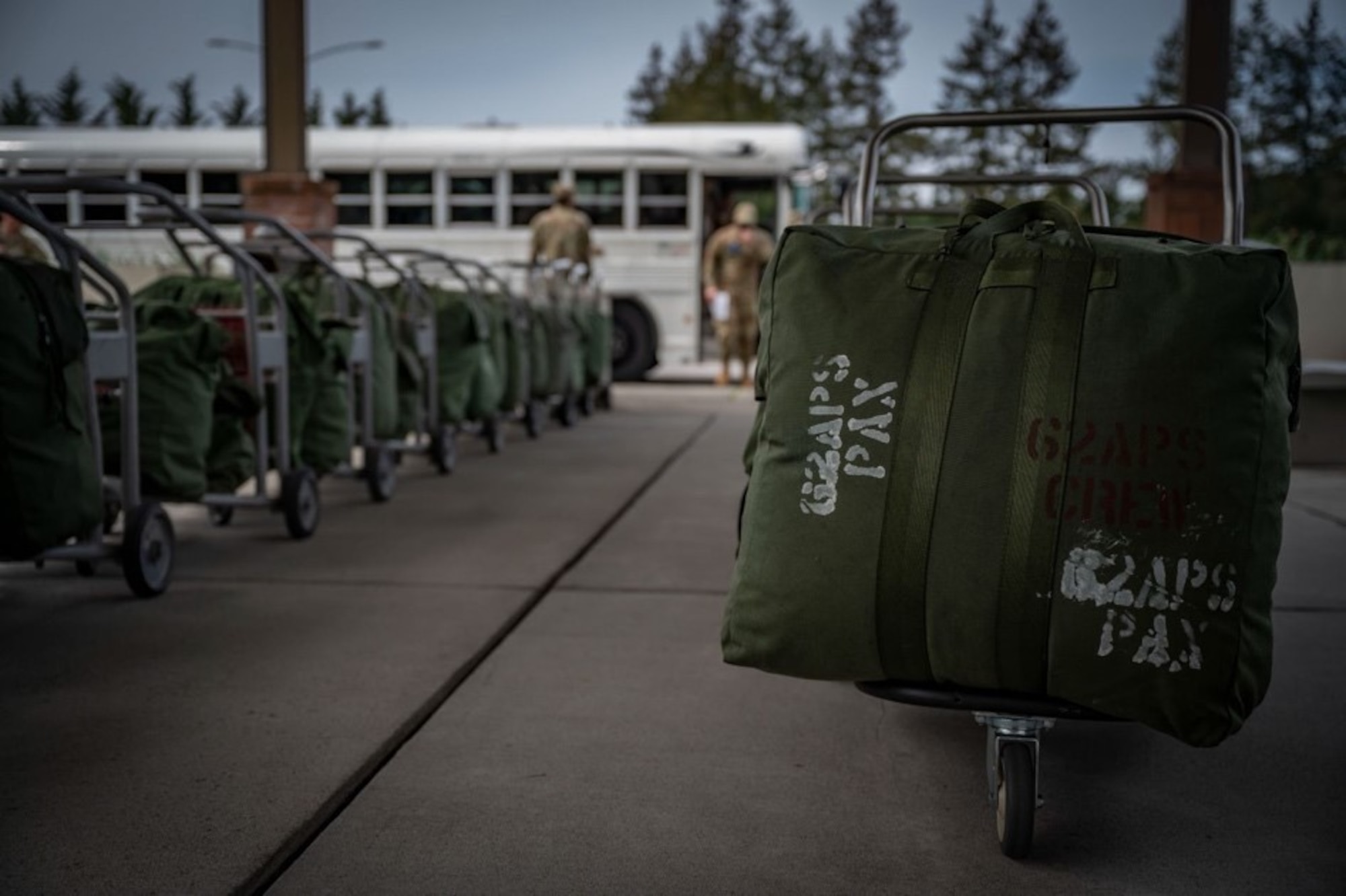 Team McChord Airmen participate in Patriot Express training at Joint Base Lewis-McChord, Washington, May 4, 2022. The PE mission is a commercial charter mission supporting official-duty travelers and their families to overseas locations, operating out of the McChord Passenger Terminal for the first time. (U.S. Air Force photo by Airman 1st Class Charles Casner)