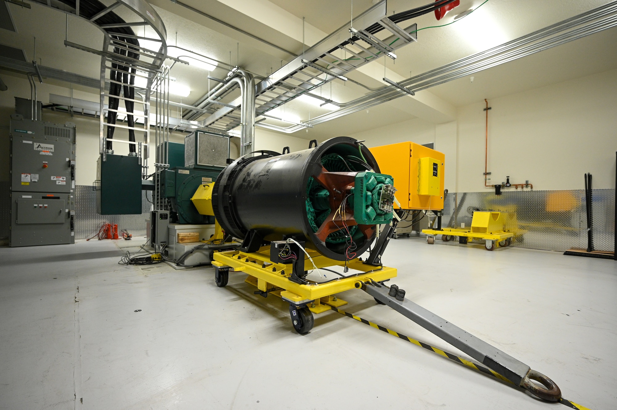 The generator for a Base Expeditionary Airfield Resources (BEAR) power unit sits inside a newly designed test facility at Hill Air Force Base, Utah, April 26, 2022. The 526th EMXS activated a new maintenance workload on BEAR units after successfully testing the unit's first repaired asset. BEAR power units are used to power U.S. Air Force forward operating bases. (U.S. Air Force photo by R. Nial Bradshaw)