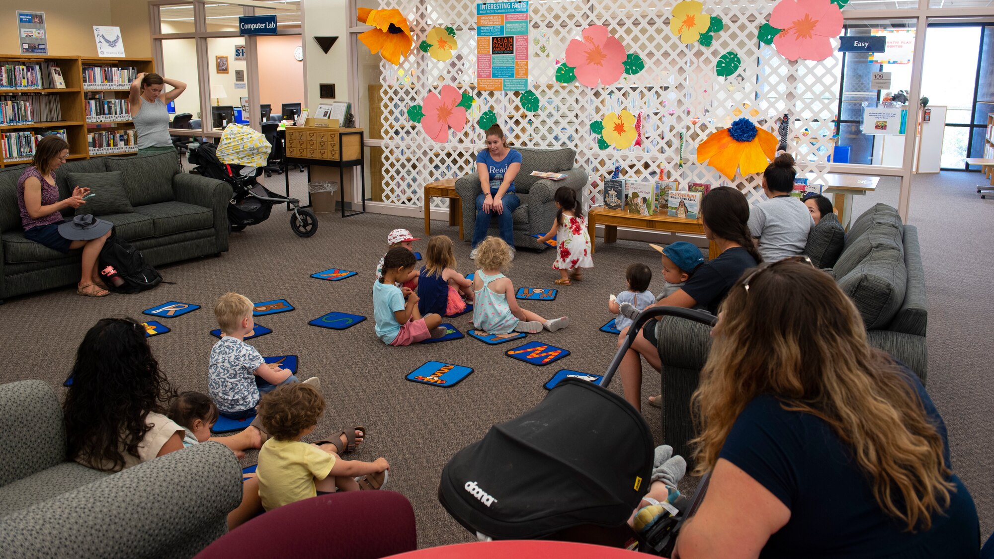 Children gather around for storytime, May 11, 2022, on Holloman Air Force Base, New Mexico.
