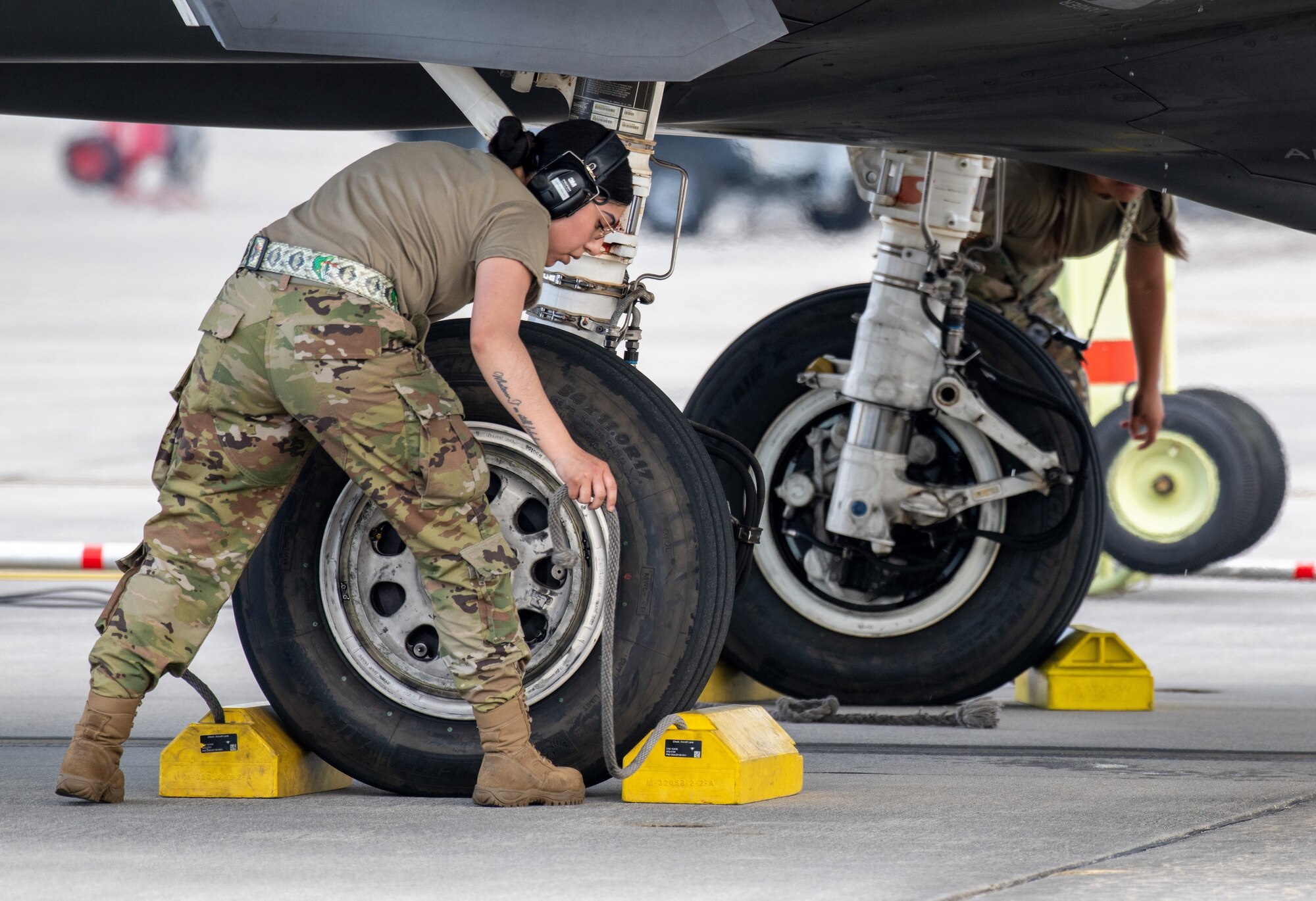 A reservist from the 419th Fighter Wing places chocks on an F-35A Lightning II fighter jet May 5, 2022 at the Air Dominance Center in Savannah, Georgia.