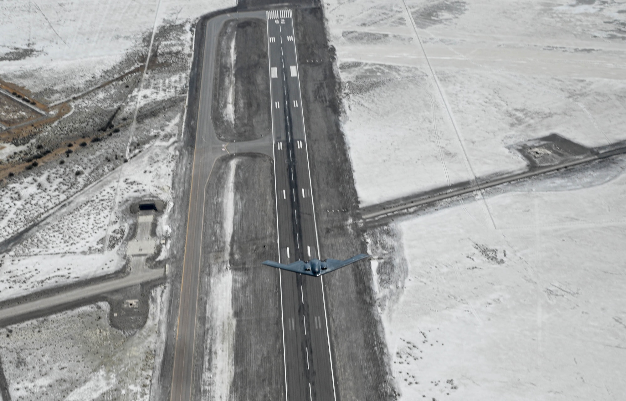 A U.S. Air Force B-2 Spirit stealth bomber, assigned to the 509th Bomb Wing, flies over Wendover Air Field, Utah, May 10, 2022. Wendover Airfield, also known as Wendover Air Force Base, was the initial training range for the 509th Composite Group.