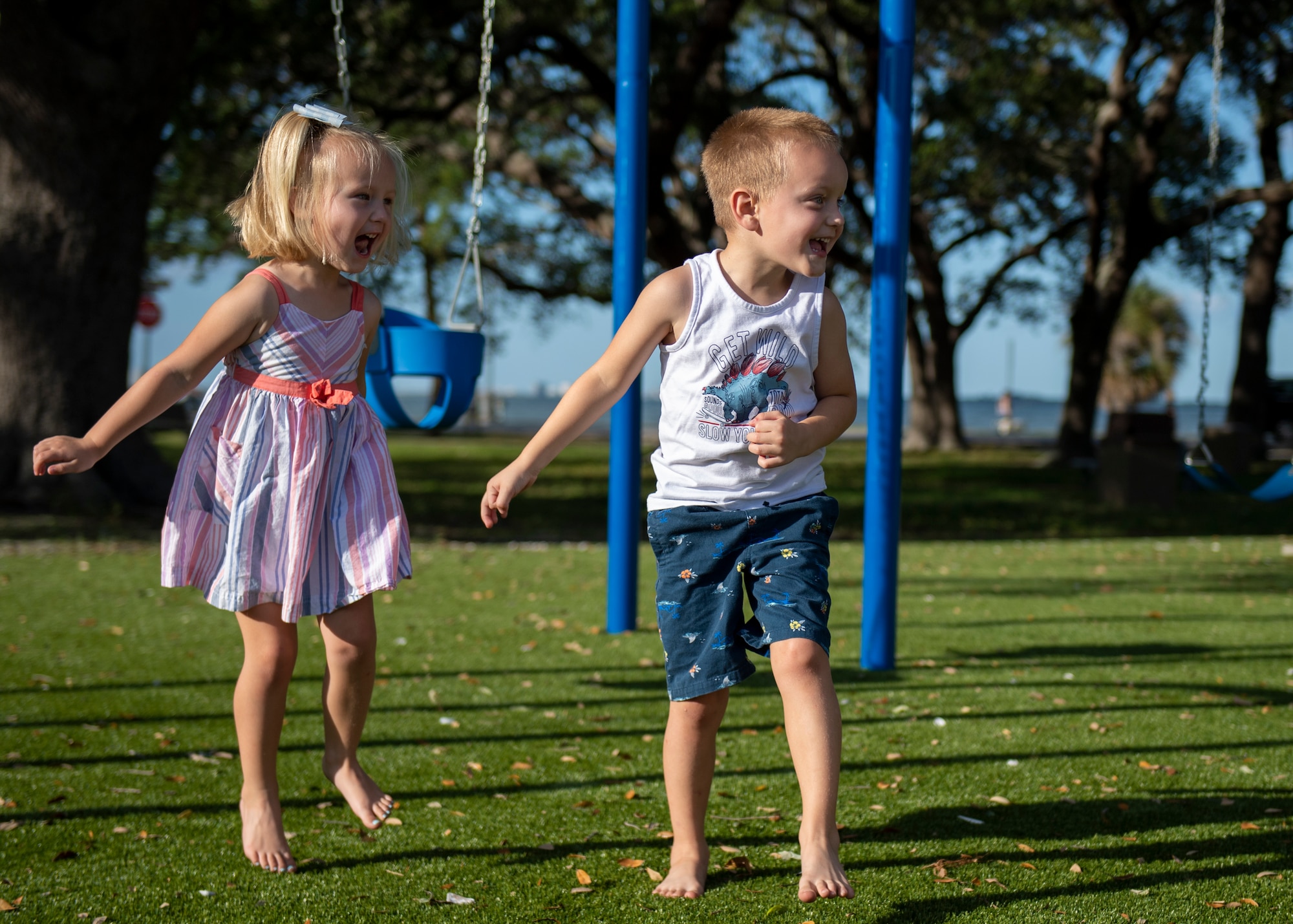 Finley and Russell Dixon play at the new all-inclusive Eagle Park Playground at MacDill Air Force Base, Florida, May 11, 2022. Nearly five years since the last playground addition at Harbor Bay, the area was designed to fit the needs of children of all ages and abilities and provide interactive elements for families to gather. (U.S. Air Force photo by Airman 1st Class Lauren Cobin)