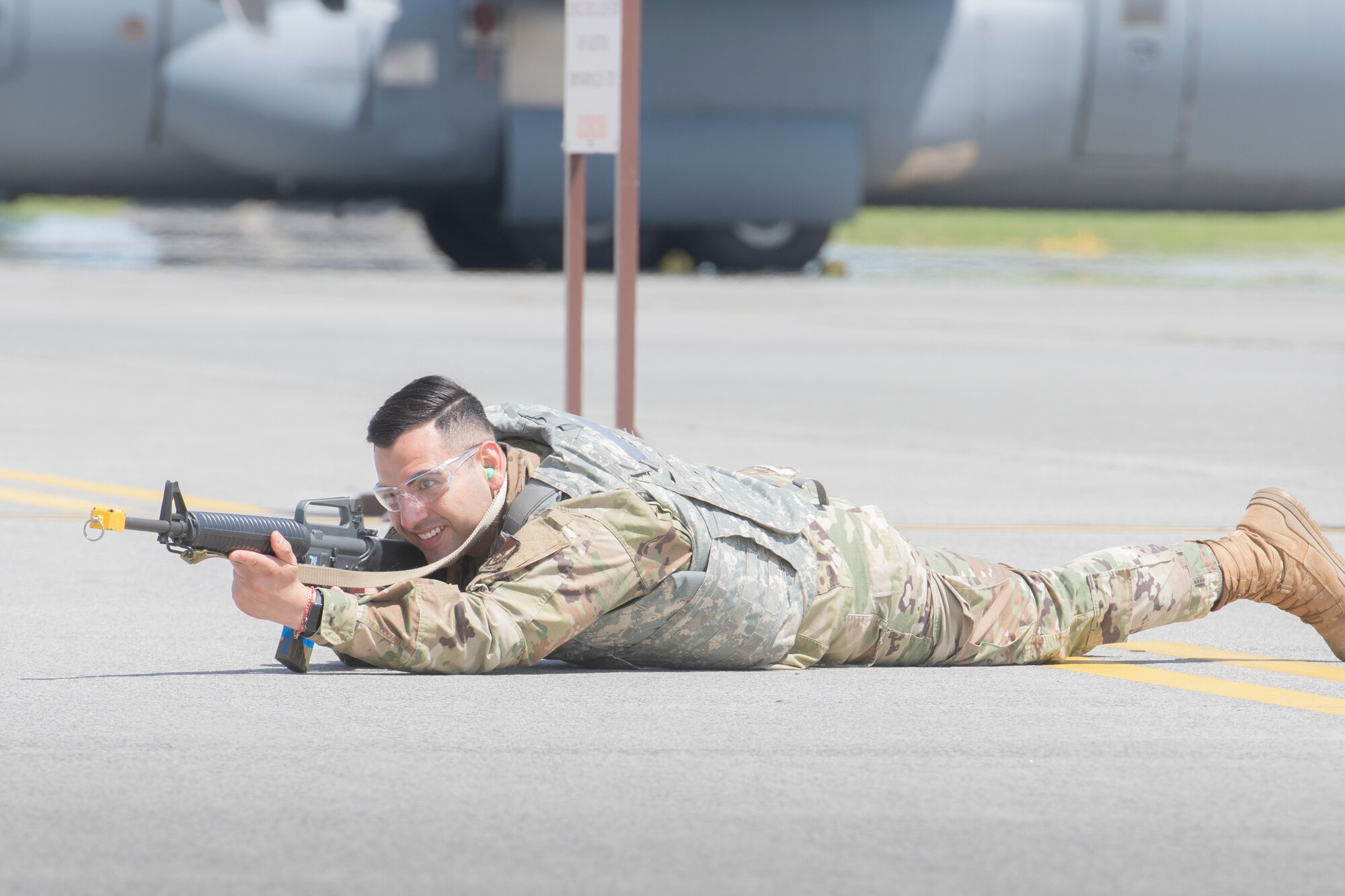 Senior Airman Raymundo Valero Delgado, 374th Comptroller Squadron financial operations technician, aims a weapon during the fly-away security training at Yokota Air Base, Japan, May 10, 2022.The 374th Security Forces Squadron conducted fly-away security training as part of a training during the exercise week. This training assessed Yokota's ability to perform Agile Combat Employment across a range of military operations in a complex and dynamic international security environment. (U.S. Air Force photo by Machiko Arita)