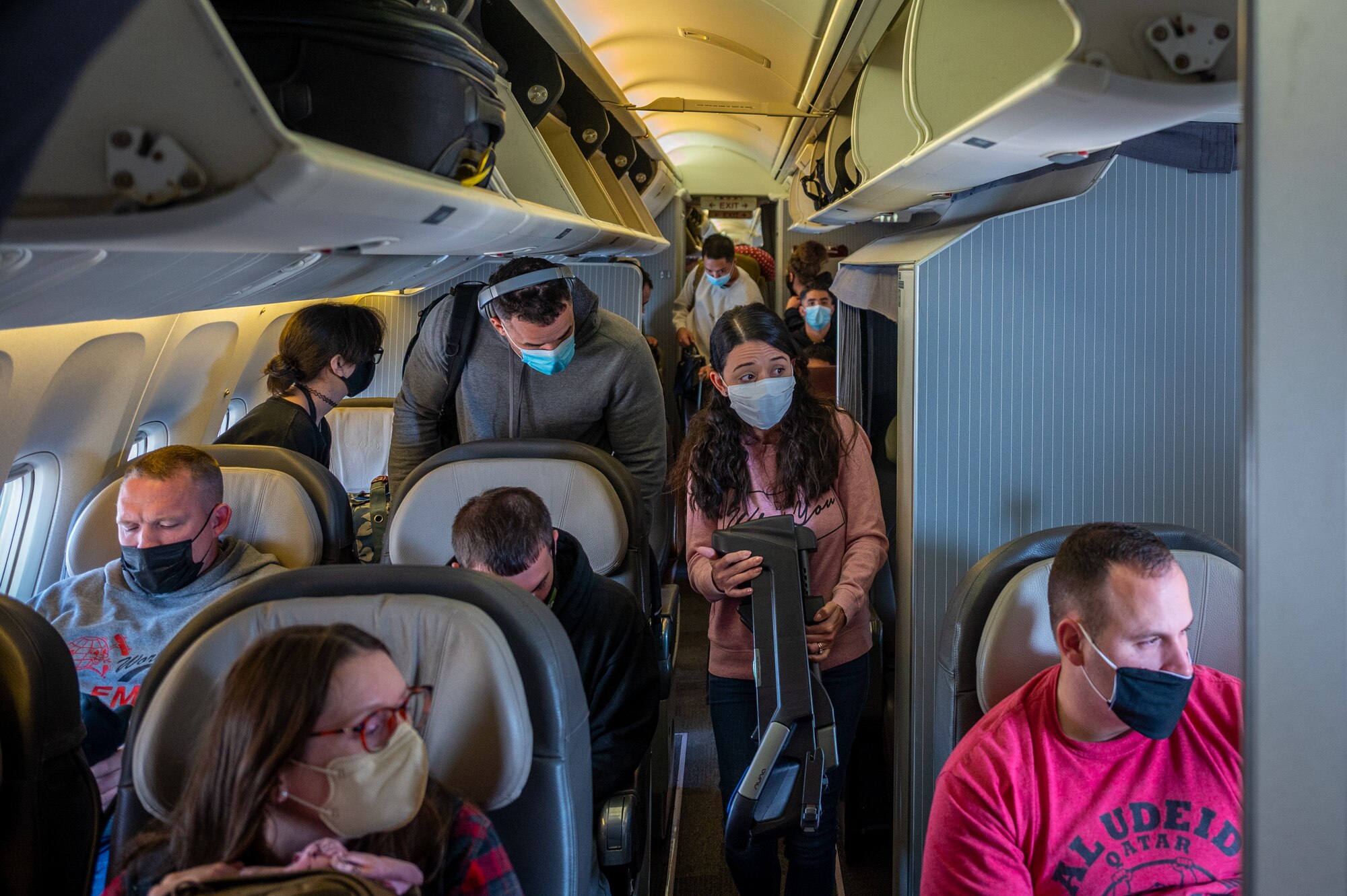 Passengers prepare to exit the aircraft after landing