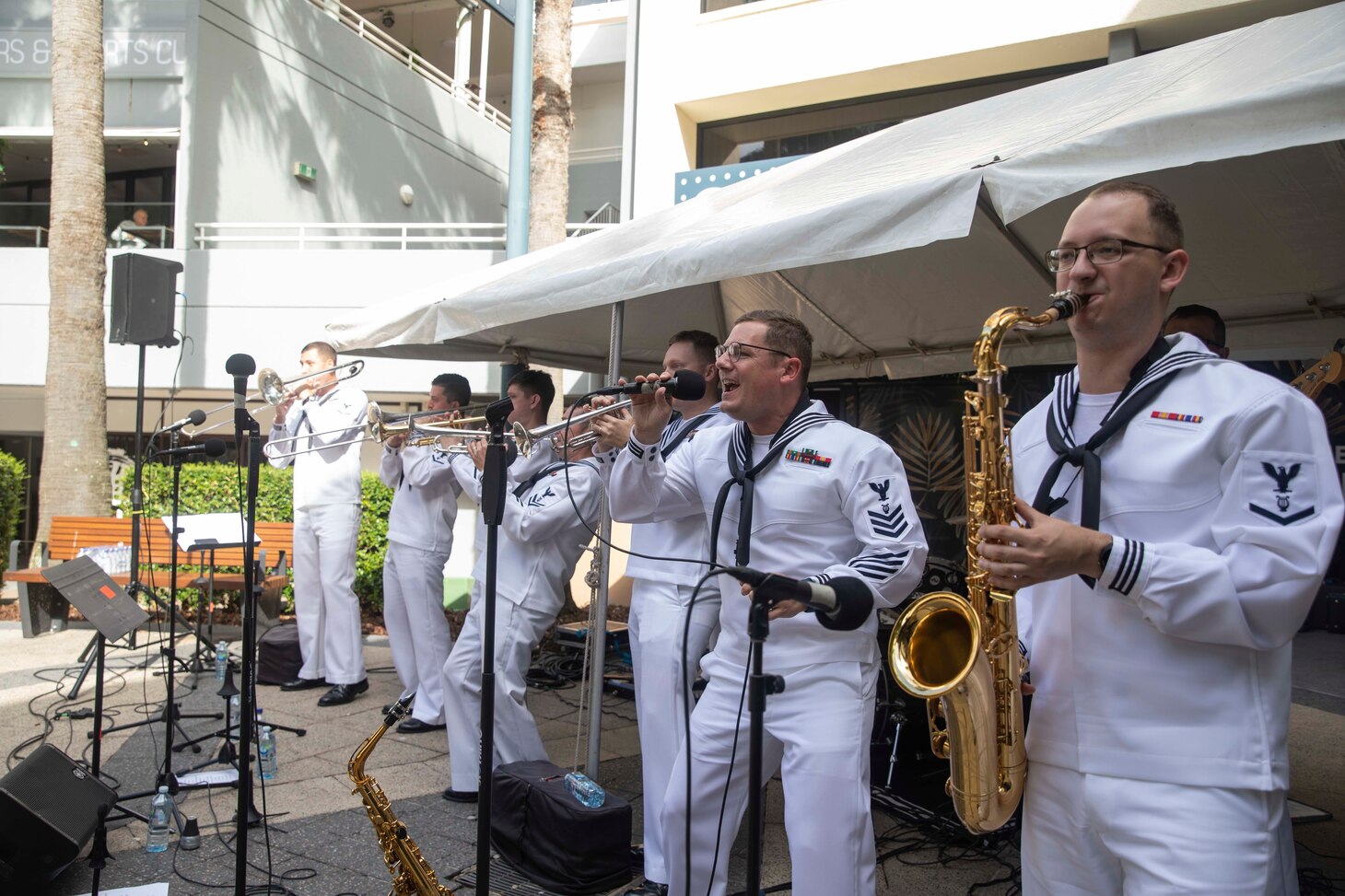 220508-N-VD554-1138 SURFERS PARADISE, Australia (May 8, 2022) – Members of the U.S. 7th Fleet Band perform at Cavil Avenue Park in Surfers Paradise, Australia. Under Commander, U.S. Pacific Fleet, 7th Fleet is the U.S. Navy's largest forward-deployed numbered fleet, and routinely interacts and operates with 35 maritime nations in preserving a free and open Indo-Pacific region. (U.S. Navy photo by Mass Communication Specialist 2nd Class Aron Montano)