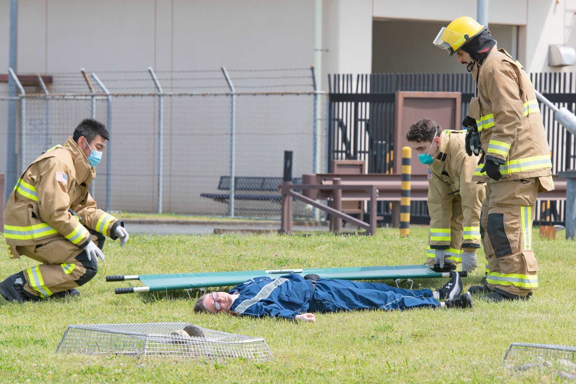 Firefighters with the 374th Civil Engineer Squadron Fire Department prepare to transport a simulated injured person during a major accident response exercise at Yokota Air Base, Japan, May 11, 2022. The MARE tested the base’s response to a simulated F-16 Fighting Falcon crash and the ability to collaborate with mission partners. Due to the support of Naval Air Facility Atsugi, Commander Fleet Activities Yokosuka, Misawa Air Base and Tokyo Fire Department, Fussa Fire Station, this was the largest MARE in Yokota history. (U.S. Air Force photo by Machiko Arita)