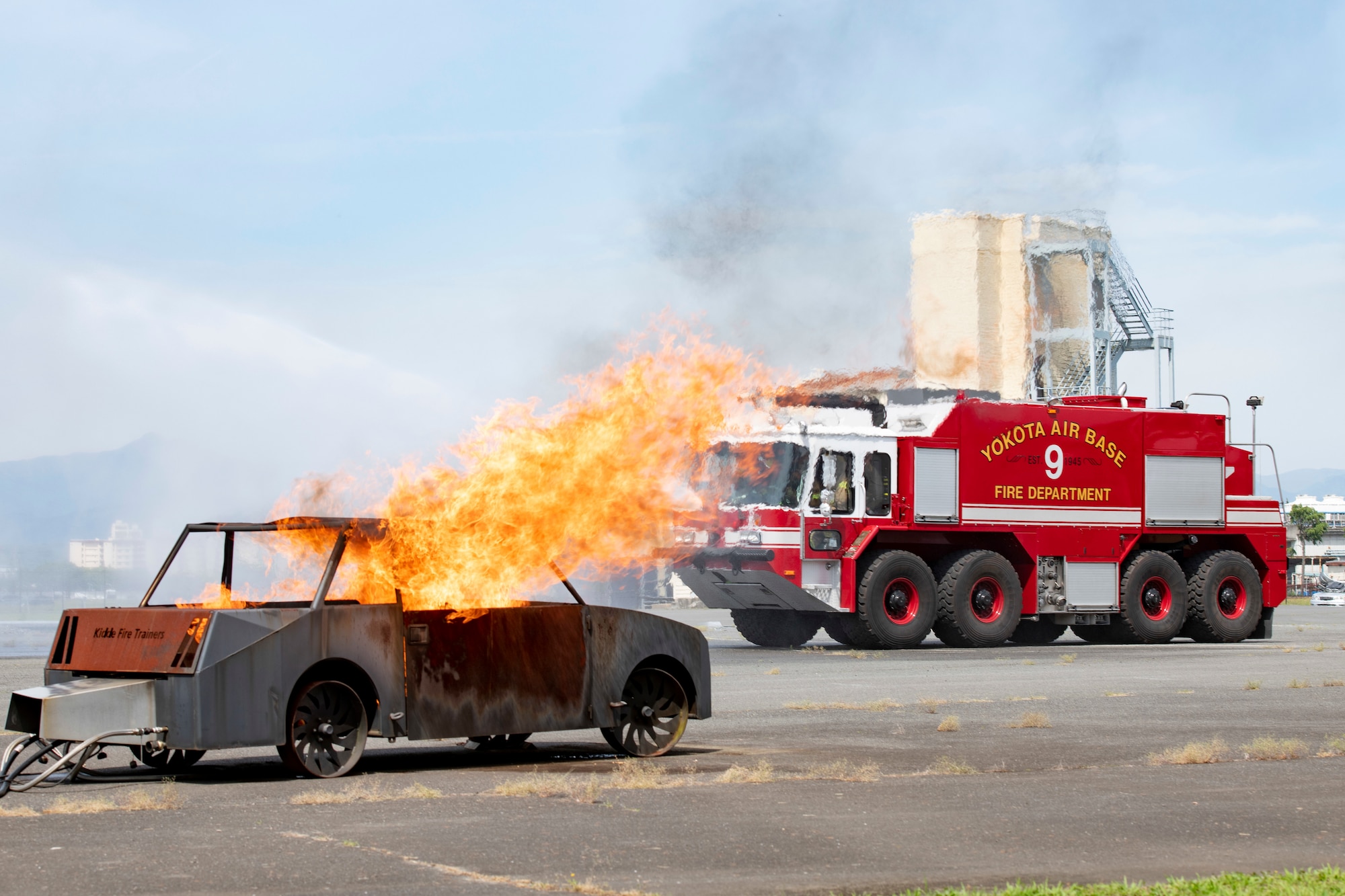 The 374th Civil Engineer Squadron Fire Department responds to a simulated aircraft incident during a major accident response exercise at Yokota Air Base, Japan, May 11, 2022. The MARE tested the base’s response to a simulated F-16 Fighting Falcon crash and the ability to collaborate with mission partners. Due to the support of Naval Air Facility Atsugi, Commander Fleet Activities Yokosuka, Misawa Air Base and Tokyo Fire Department, Fussa Fire Station, this was the largest MARE in Yokota history. (U.S. Air Force photo by Machiko Arita)