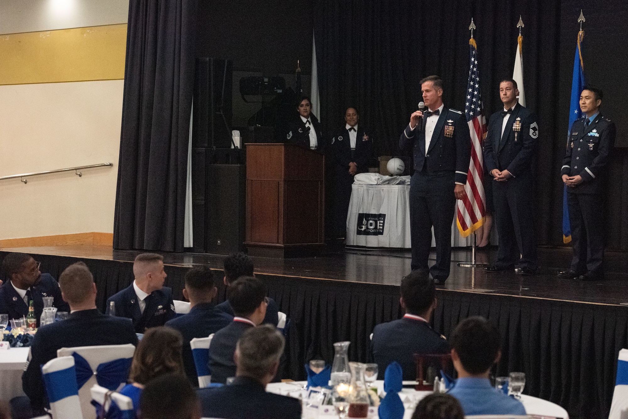 The 51st Fighter Wing commander, Col. Joshua Wood, delivers a congratulatory speech to graduates of Airman Leadership School