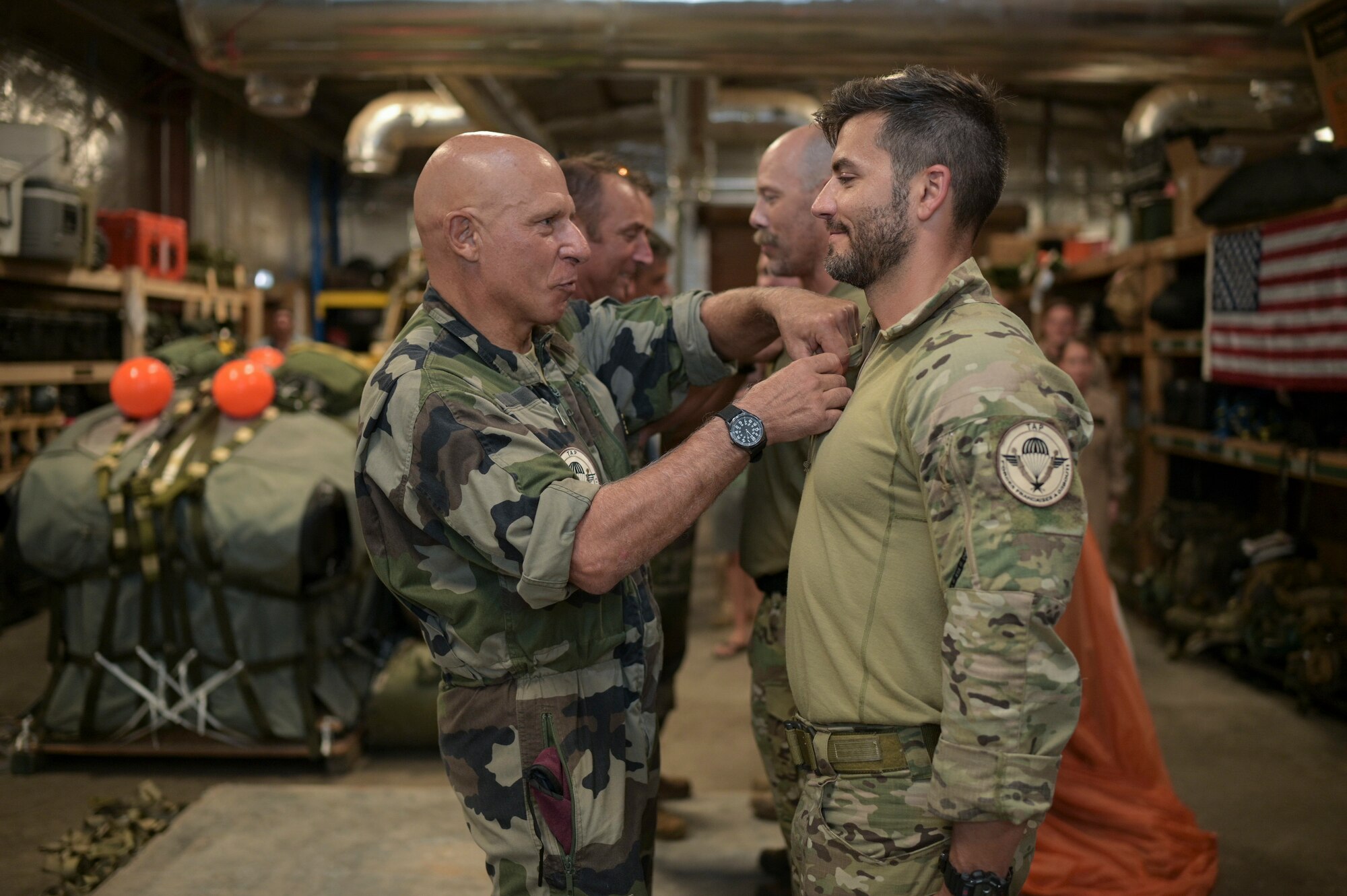 U.S. Air Force pararescue specialists with the 82nd Expeditionary Rescue Squadron receive French Parachutist Foreign Jump Wings