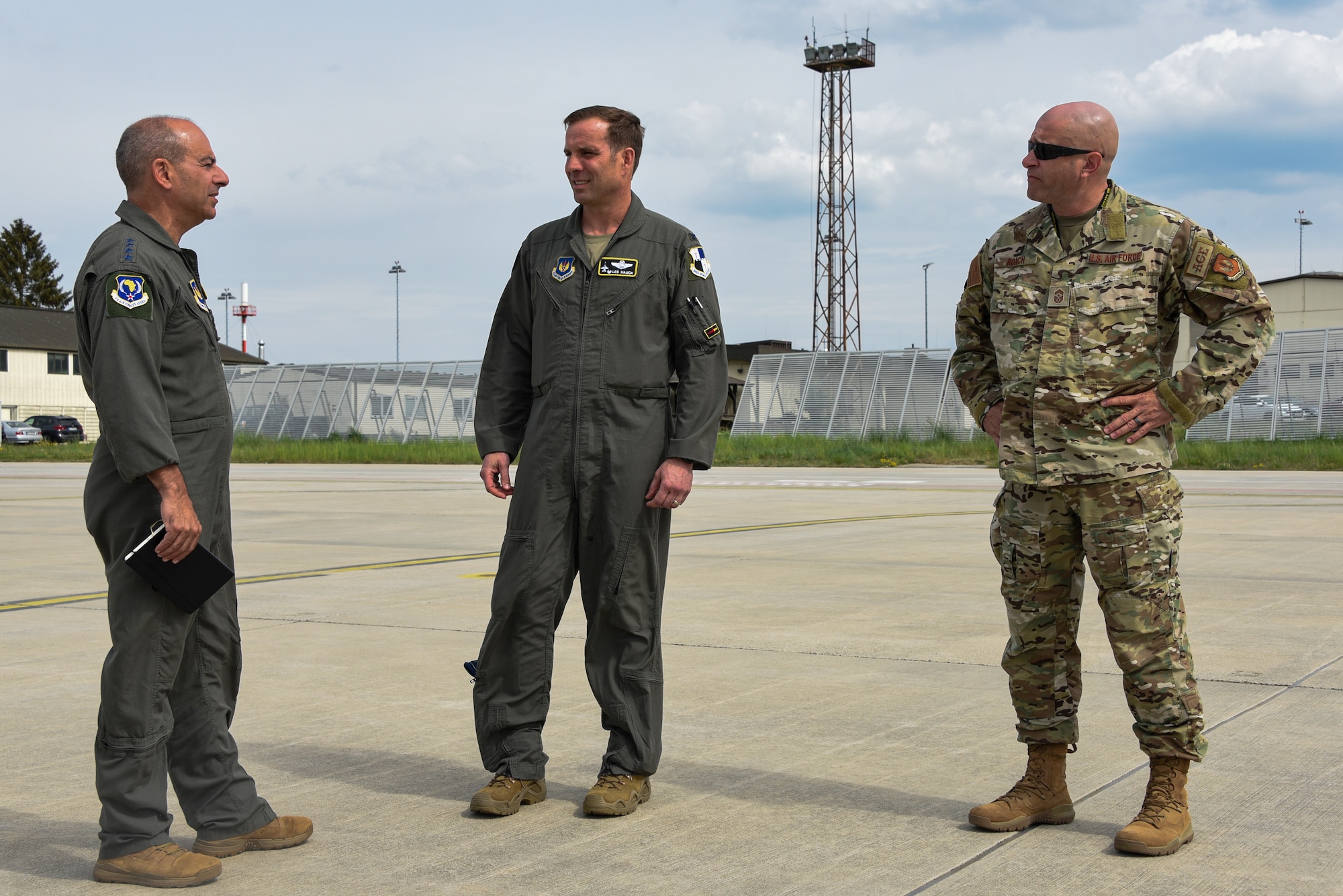 USAFE-AFAFRICA commander is greeted by 52nd FW commander and command chief.
