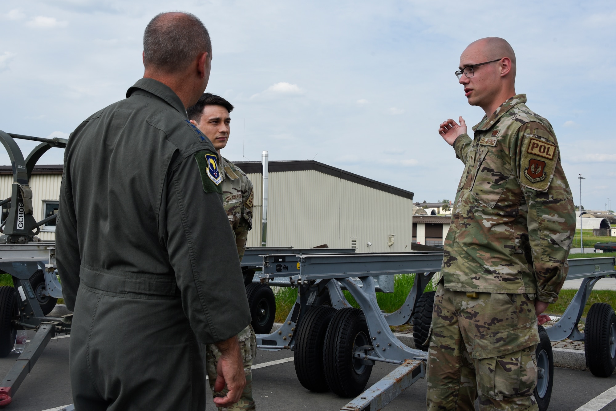 Senior Airman Joshua Flieger briefs U.S. Air Force Gen. Jeff Harrigian, U.S. Air Forces in Europe and Air Forces Africa commander.
