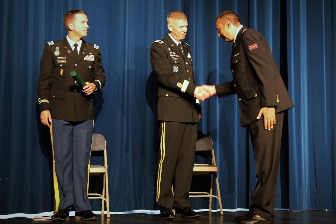 Maj. Gen. Jeff Broadwater, deputy commanding general of V Corps, congratulates an international student on their graduation from Intermediate Level Education – Common Core at the 7th Intermediate Level Education Detachment, 7th Mission support Command, in Grafenwoehr, May 6, 2022. 

The 7th ILE Detachment is the only Command and General Staff College in the European theater and provides education for EUCOM, AFRICOM, and CENTCOM and is one of two training facilities to host international students.