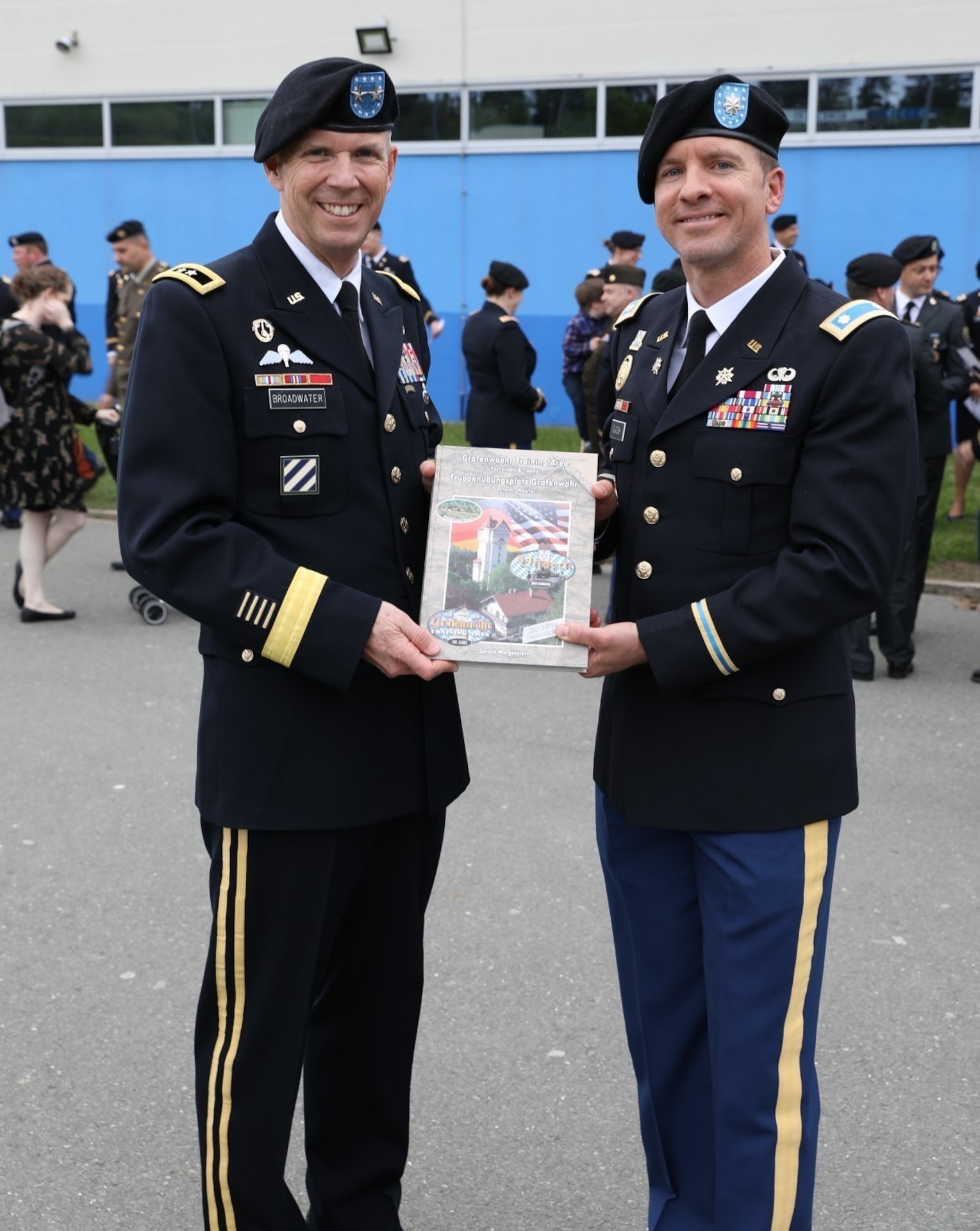 Lt. Col. David Gladish presents Maj. Gen. Jeff Broadwater with a gift of appreciation following the commencement ceremony for Intermediate Level Education – Common Core class of 2022 at the 7th Intermediate Level Education Detachment, 7th Mission Support Command, Grafenwoehr, Germany, May 6, 2022. 

The 7th ILE Detachment is the only Command and General Staff College in the European theater and provides education for EUCOM, AFRICOM, and CENTCOM and is one of two training facilities to host international students.