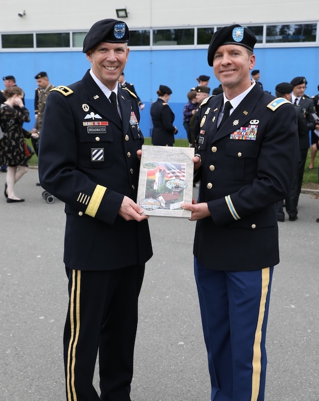 Lt. Col. David Gladish presents Maj. Gen. Jeff Broadwater with a gift of appreciation following the commencement ceremony for Intermediate Level Education – Common Core class of 2022 at the 7th Intermediate Level Education Detachment, 7th Mission Support Command, Grafenwoehr, Germany, May 6, 2022. 

The 7th ILE Detachment is the only Command and General Staff College in the European theater and provides education for EUCOM, AFRICOM, and CENTCOM and is one of two training facilities to host international students.
