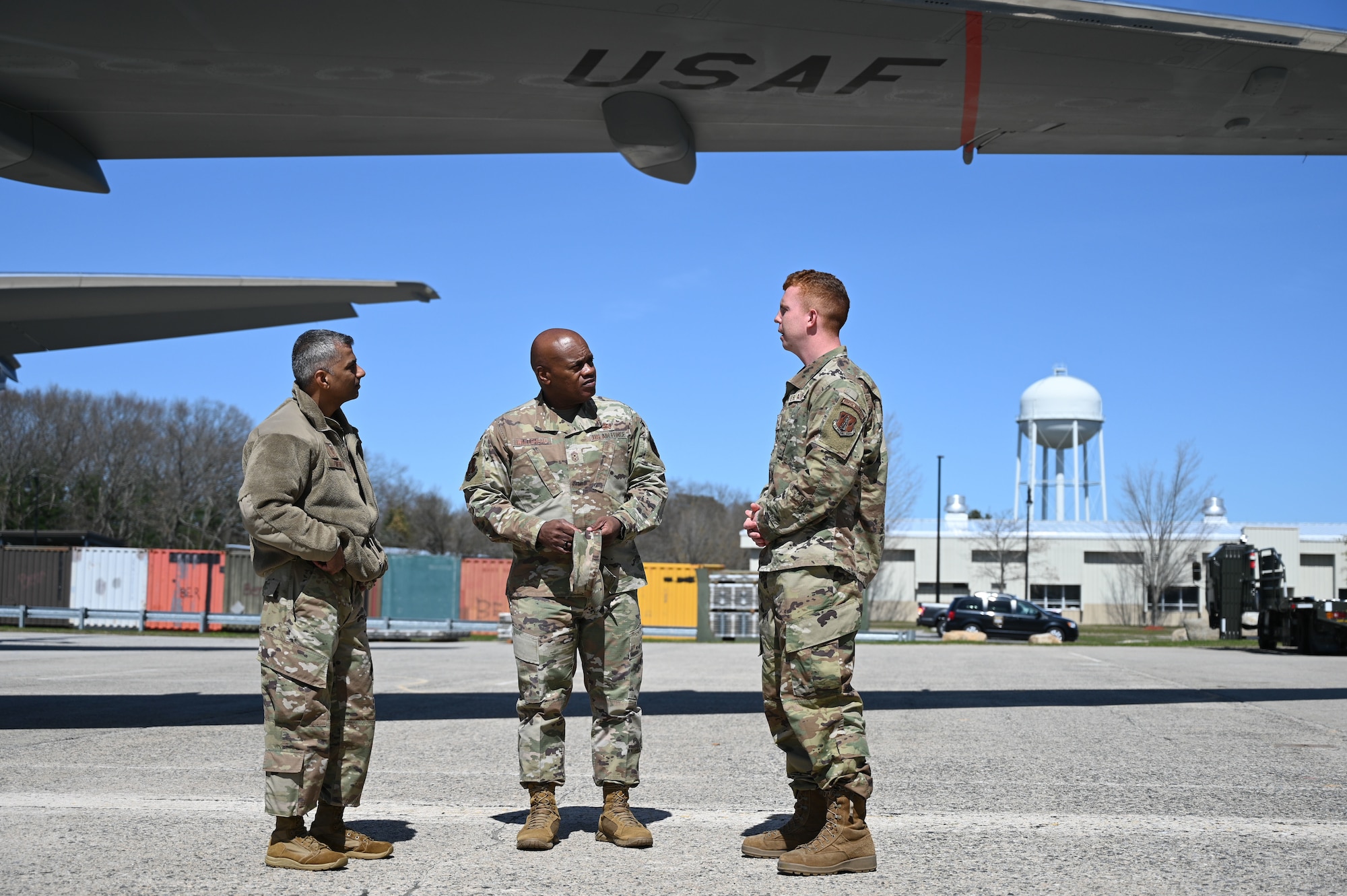 Senior Enlisted Advisor Tony Whitehead speaks with Airmen near aircraft