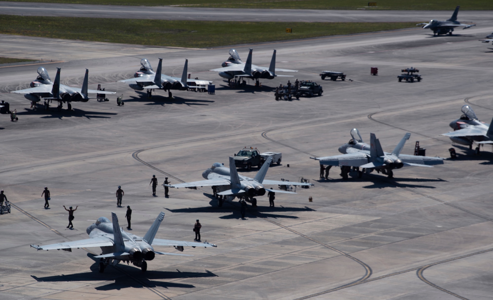 U.S. Sailors and U.S. Airmen recover their respective aircraft following a Checkered Flag 22-2