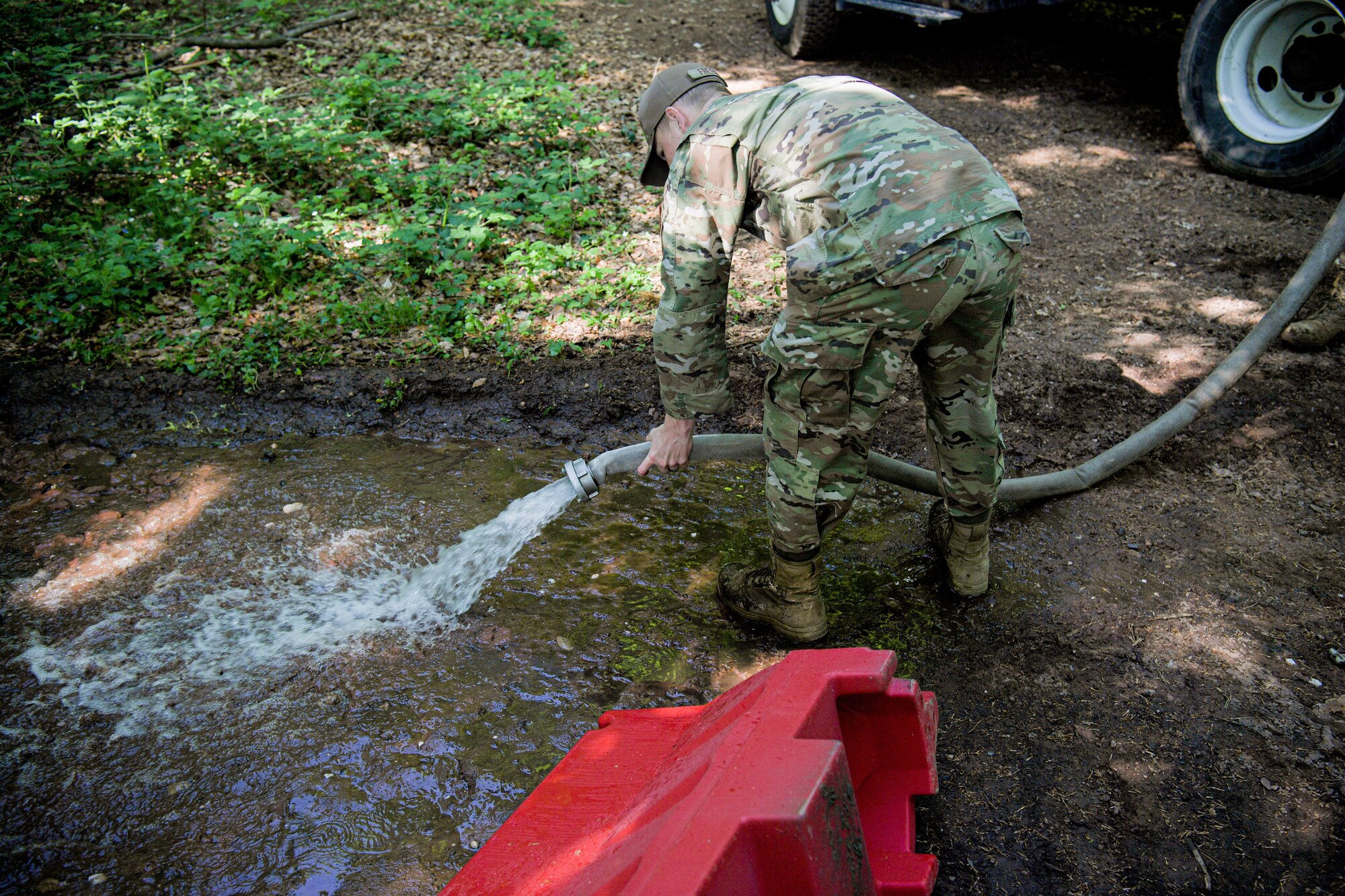 man sprays water