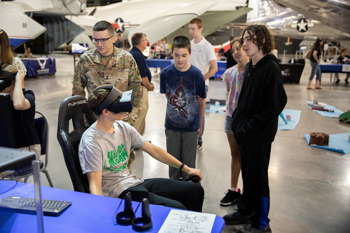 WRIGHT-PATTERSON AIR FORCE BASE (AFRL), Ohio – A student experiences a virtual reality game during the Full Throttle STEM event May 12, 2022, at the National Museum of the United States Air Force, at Wright-Patterson Air Force Base, Ohio. This was the first time the science, technology, engineering and math event extended to the museum. The Air Force Research Laboratory’s Gaming Research Integration for Learning Lab, or GRILL, hosted the events with 12 schools in attendance between both locations. (U.S. Air Force photo / Will Graver)