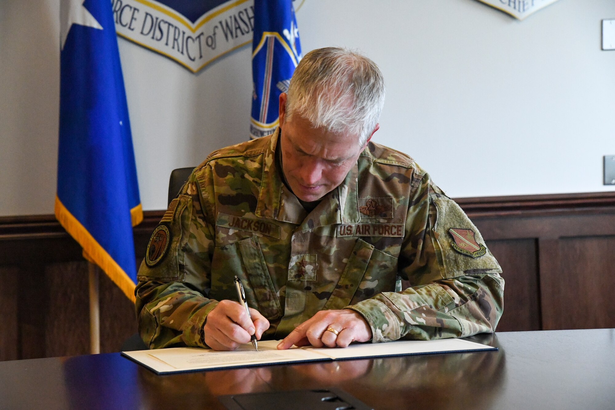 Man in uniform signs contract