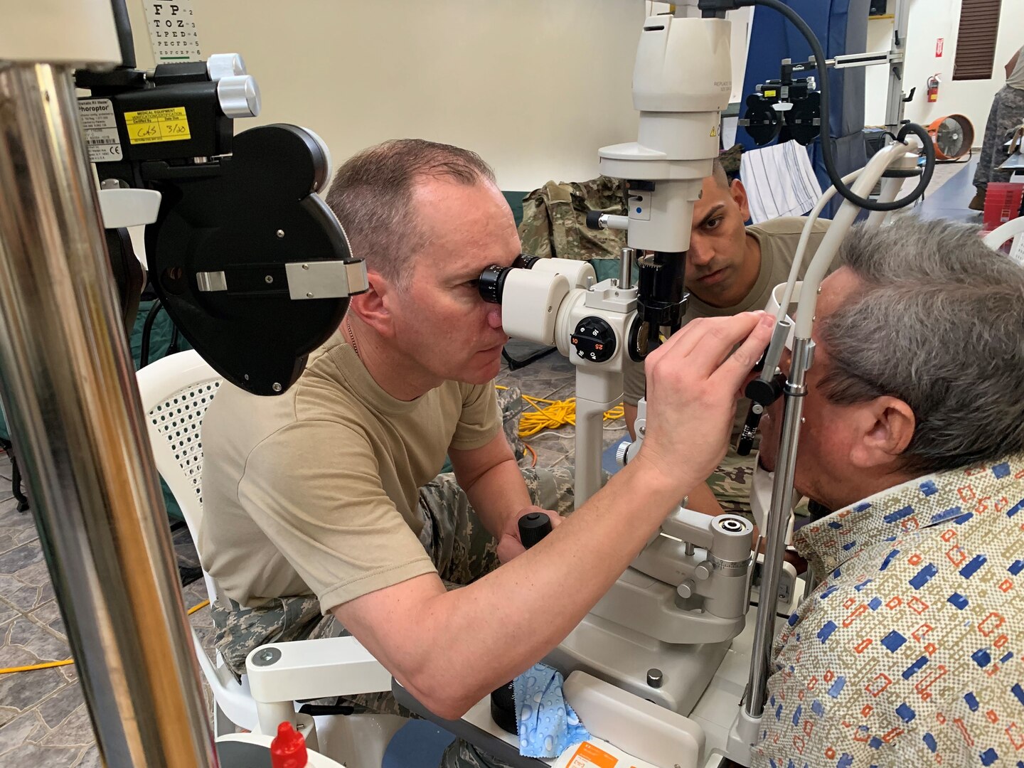 Maj. Erik Zingler, optometry officer in charge for the 155th Medical Group, Lincoln, Neb., performs an optometry vision test May 2, 2019, in Residential Juan Ferrer, Puerto Rico. Zingler is a member of Innovative Readiness Training, a Defense Department program to increase deployment readiness while providing key services such as optometry to American communities with limited access to resources.