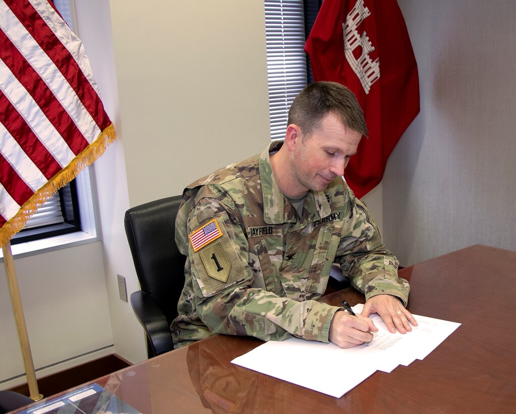 Col. Travis Rayfield, commander, Kansas City District signs agreement with the Missouri Dept. of Natural Resources to begin aquatic restoration in the Osage River near Brockman Springs Road, Missouri, May 6, 2022.