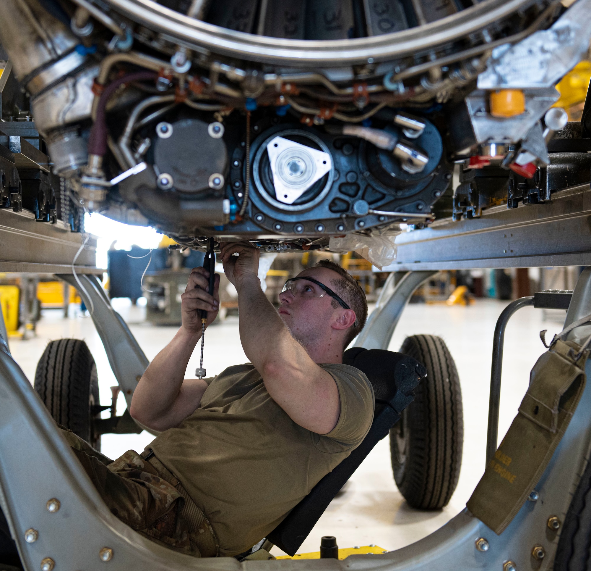 Airman 1st Class Jordan Newberry, 4th Component Maintenance Squadron aerospace propulsion apprentice, maintains the engine of an F-15E Strike Eagle at Seymour Johnson Air Force Base, North Carolina, April 7, 2022. Aerospace propulsion Airmen diagnose engine problems within the fuel, oil, electrical and engine airflow systems to ensure all components of the engine are in operational conditions. (U.S. Air Force photo by Airman 1st Class Sabrina Fuller)