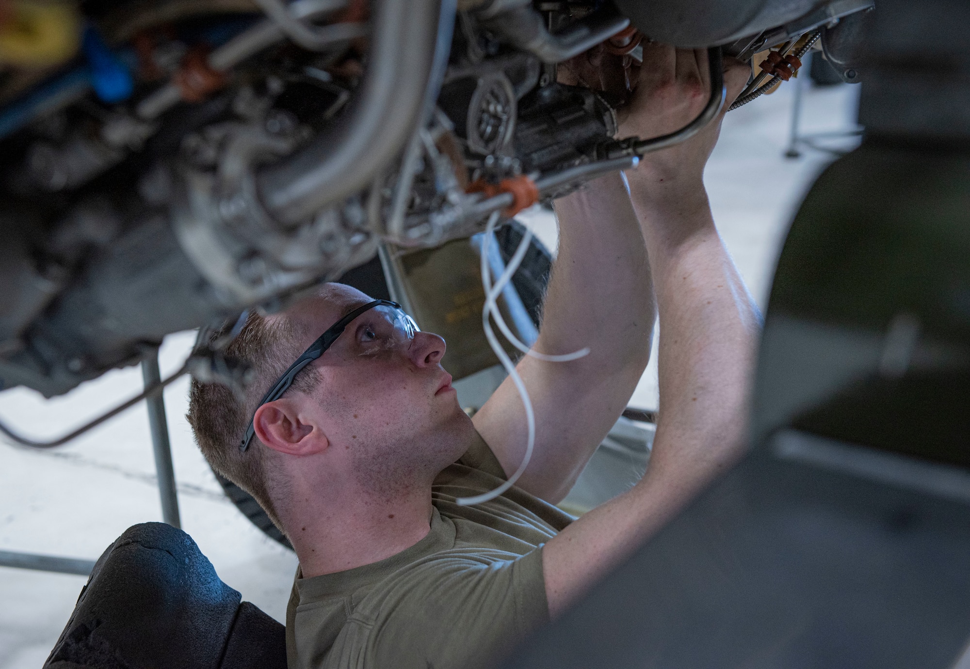 Airman 1st Class Jordan Newberry, 4th Component Maintenance Squadron aerospace propulsion apprentice, checks the engine of an F-15E Strike Eagle at Seymour Johnson Air Force Base, North Carolina, April 7, 2022. Aerospace propulsion Airmen are responsible for ensuring all of the 4th Fighter Wing’s F-15 engines are tested, properly maintained and repaired as needed.  (U.S. Air Force photo by Airman 1st Class Sabrina Fuller)