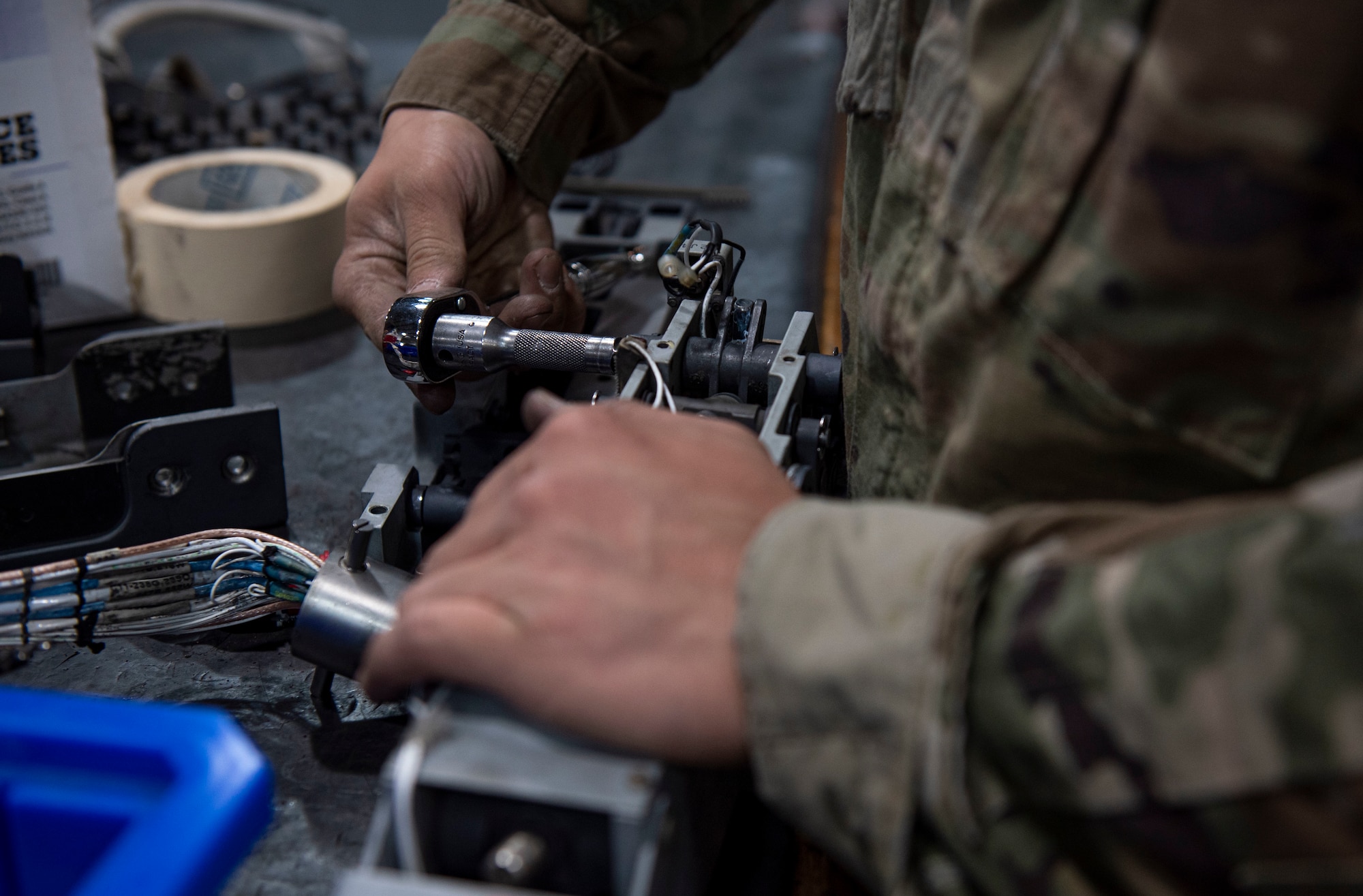 Senior Airman Kevin Kinkade, 4th Munitions Squadron armament maintenance member, performs an inspection on a dampener at Seymour Johnson Air Force Base, North Carolina, May 12, 2022. The dampener is an internal component to the missile launcher, which holds the missile in place. (U.S. Air Force photo by Airman 1st Class Sabrina Fuller)