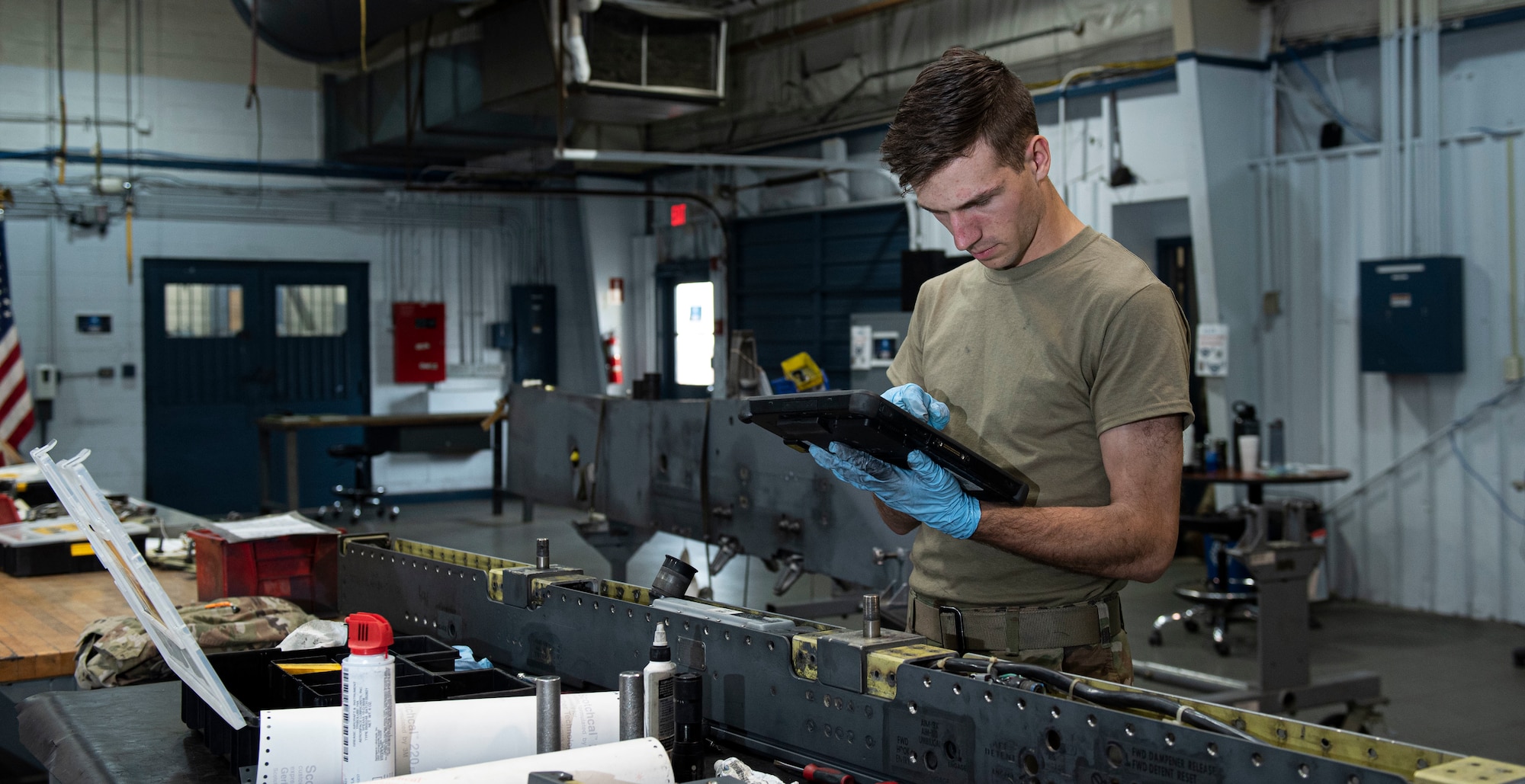 Senior Airman Isaac Carlsen, 4th Munitions Squadron maintenance member, performs an 18-month inspection on a Launcher-128 at Seymour Johnson Air Force Base, North Carolina, May 12, 2022. Airmen perform inspections on weaponry to reduce the possibility of malfunctions while loading missiles onto F-15E Strike Eagle aircraft. (U.S. Air Force photo by Airman 1st Class Sabrina Fuller)