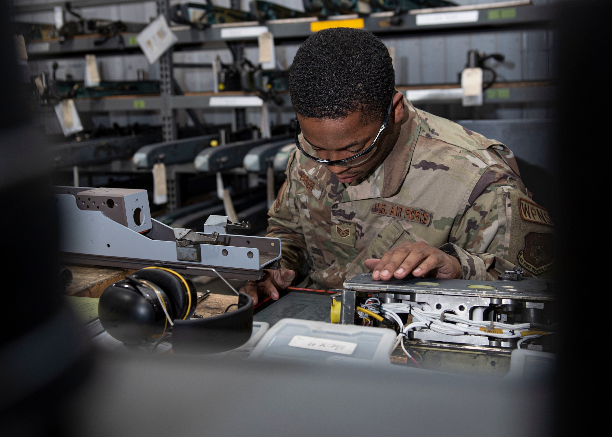 Staff Sgt. Khari Parker, 4th Munitions Squadron armament maintenance member, performs an 18-month inspection on a Launcher-128 at Seymour Johnson Air Force Base, North Carolina, May 12, 2022. Airmen ensure reliable armament so that there is a positive connection between weaponry and the F-15E Strike Eagle aircraft. (U.S. Air Force photo by Airman 1st Class Sabrina Fuller)