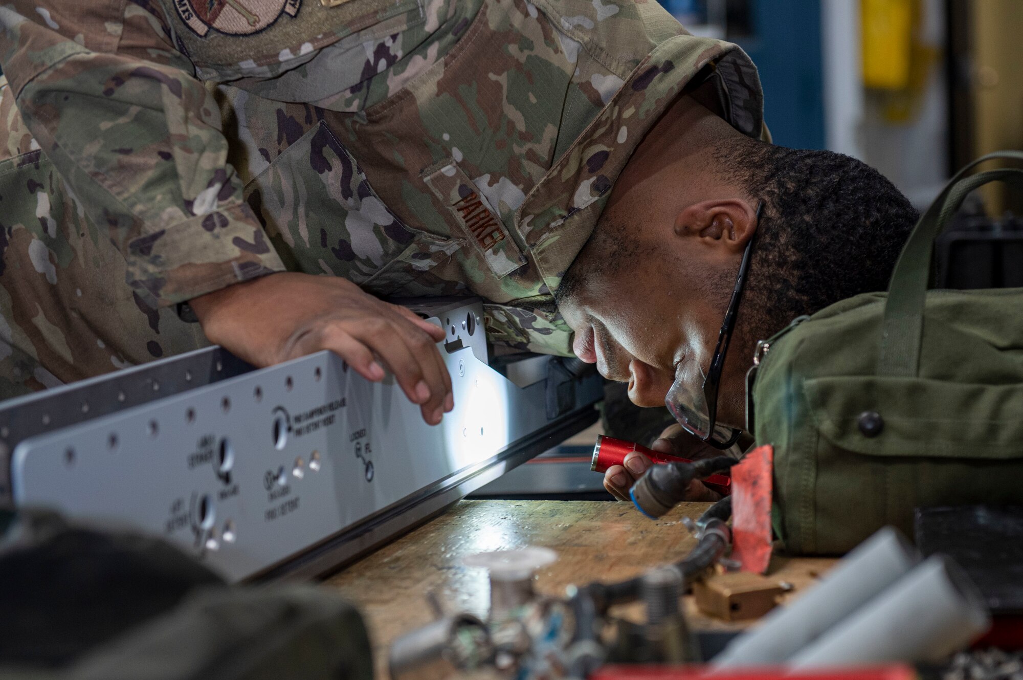 Staff Sgt. Khari Parker, 4th Munitions Squadron armament maintenance member, performs an 18-month inspection on a Missile Launcher-128 at Seymour Johnson Air Force Base, North Carolina, May 12, 2022. Airmen perform inspections on weaponry to reduce the possibility of malfunctions while loading missiles onto F-15E Strike Eagle aircraft. (U.S. Air Force photo by Airman 1st Class Sabrina Fuller)