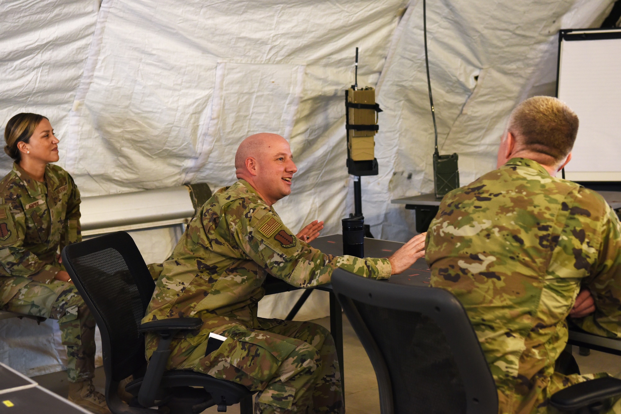 U.S Air Force Col. Matthew Reilman, 17th Training Wing commander, discusses multi-service collaborative ideas with Army Command Sgt. Maj.Thomas Baird, National Geospatial-intelligence Agency command senior enlisted leader, at Forward Operating Base Sentinel, Goodfellow Air Force Base, Texas, May 12, 2022. Baird advises the NGA director on the effective utilization of all military service members under its command. (U.S. Air Force photo by Senior Airman Abbey Rieves)