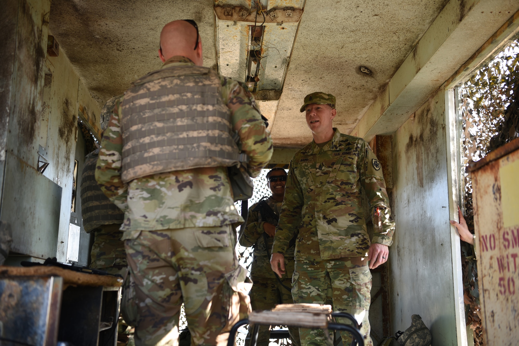 U.S. Army Command Sgt. Maj. Thomas Baird, National Geospatial-intelligence Agency command senior enlisted leader, questions students assigned to the 344th Military Intelligence Battalion about their training experience at Forward Operating Base Sentinel, Goodfellow Air Force Base, Texas, May 12, 2022. Baird visited the 17th Training Wing to enhance his understanding of the mission. (U.S. Air Force photo by Senior Airman Abbey Rieves)