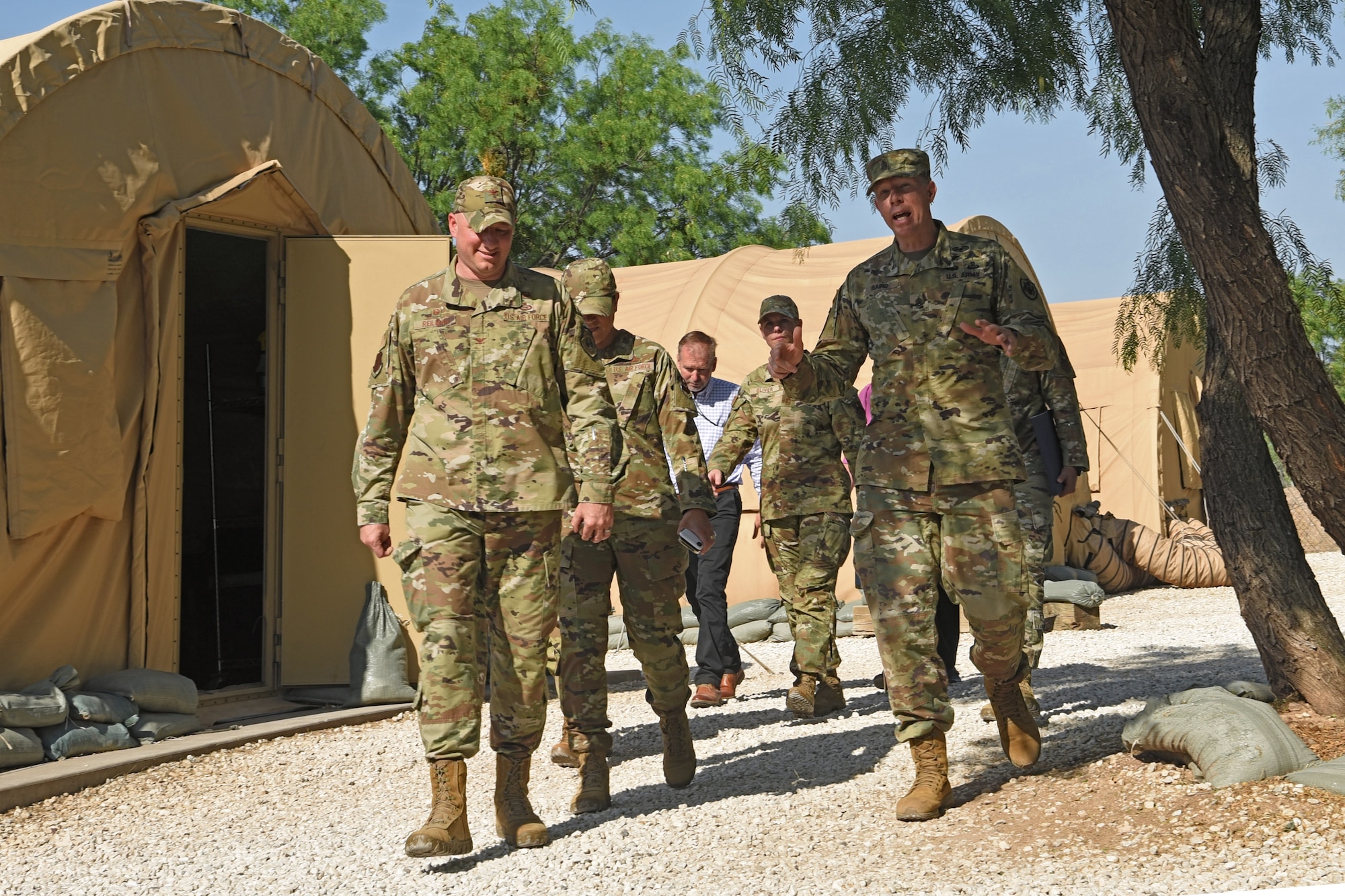 U.S Air Force Col. Matthew Reilman, 17th Training Wing commander, discusses future joint service collaborative ideas with Army Command Sgt. Maj.Thomas Baird, National Geospatial-intelligence Agency command senior enlisted leader, at Forward Operating Base Sentinel, Goodfellow Air Force Base, Texas, May 12, 2022. Baird visited the 17th Training Wing to understand the Air Force’s geospatial intelligence and imagery training with the intent of shaping a ‘GEOINT Training Evolution’ project slated for 2030-2035. (U.S. Air Force photo by Senior Airman Abbey Rieves)