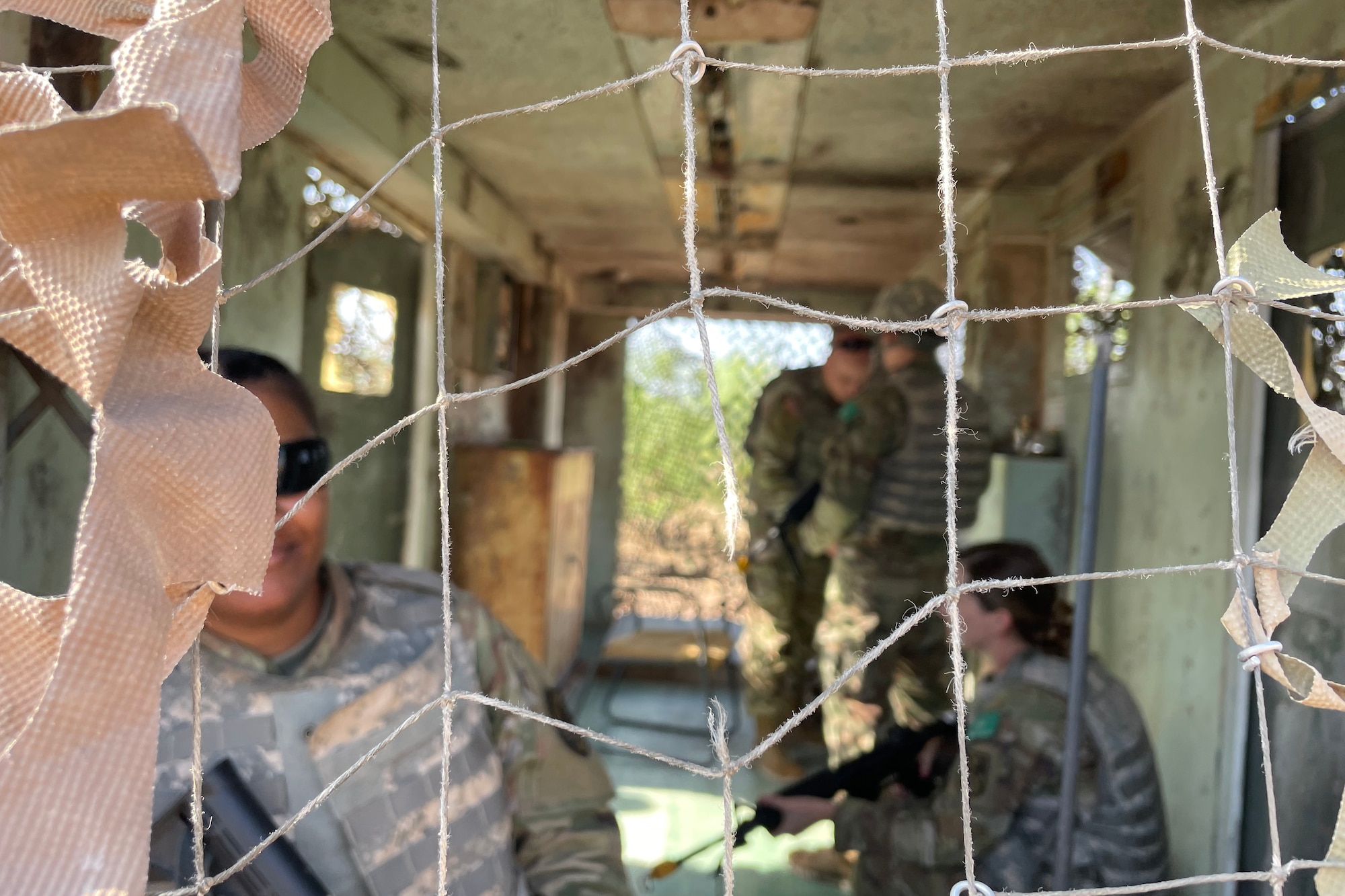 U.S. Army students assigned to the 344th Military Intelligence Battalion participate in their capstone assessment at Forward Operating Base Sentinel, Goodfellow Air Force Base, Texas, May 12, 2022. FOB Sentinel is a simulated austere environment with stacked mock adversary encounters, which the 17th Training Wing leverages to build joint coalition warriors. (U.S. Air Force photo by Senior Airman Abbey Rieves)