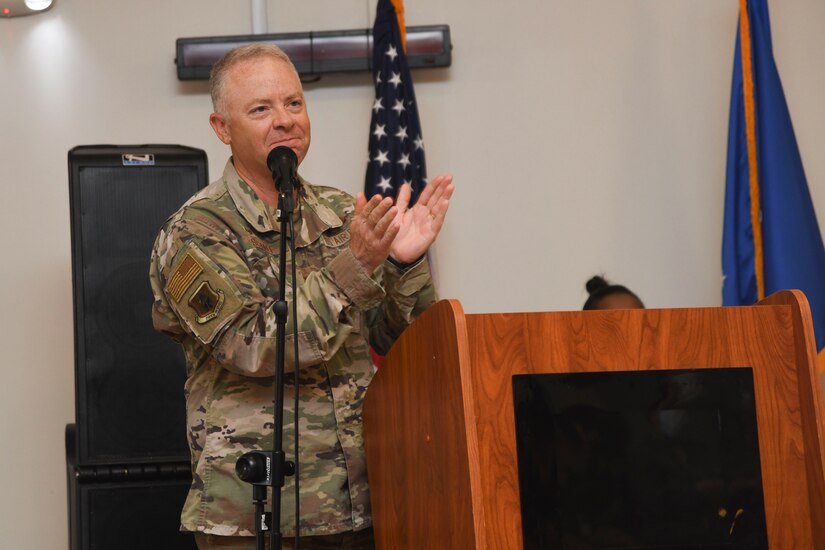 Col. Tyler R. Schaff, 316th Wing and installation commander, applauds graduates during the graduation of the transition-to-work Project SEARCH class of 2022 at Joint Base Andrews, Md., May 13, 2022. Graduates gained independence, confidence, interaction skills and self esteem through learning job-specific skills such as customer service, attention to detail and professionalism. (U.S. Air Force photo by Senior Airman Spencer Slocum)