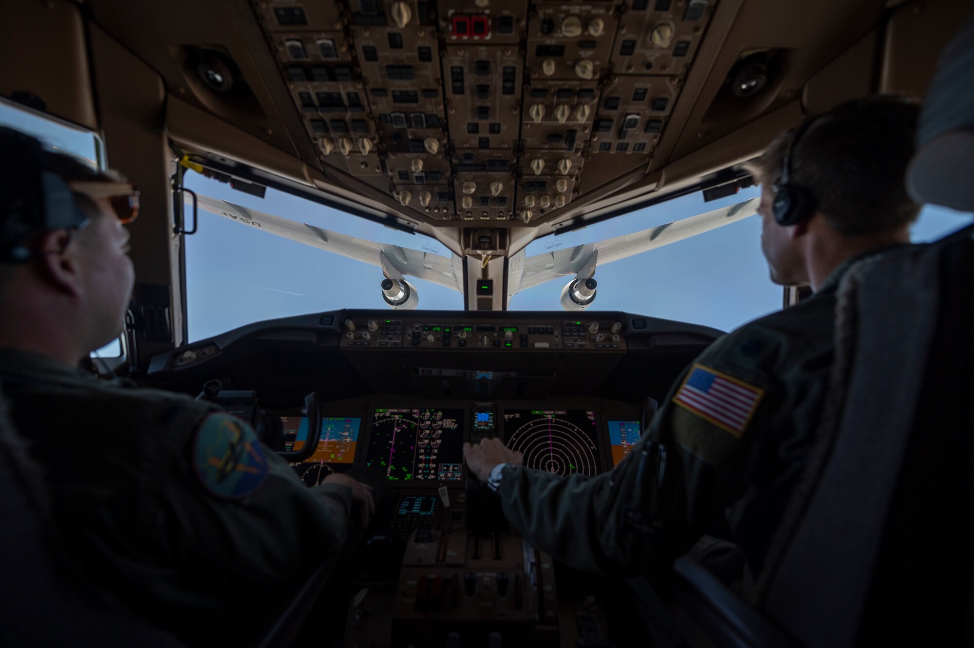 The U.S. Navy Blue Angels fly in formation alongside a KC-46A Pegasus assigned to 916th Air Refueling Wing, after being aerial refueled in the skies over Nebraska, May 11, 2022. The KC-46A helped sustain the Blue Angels by refueling during their flight from Florida to Ellsworth Air Force Base, South Dakota. (U.S. Air Force photo by Senior Airman Kevin Holloway)