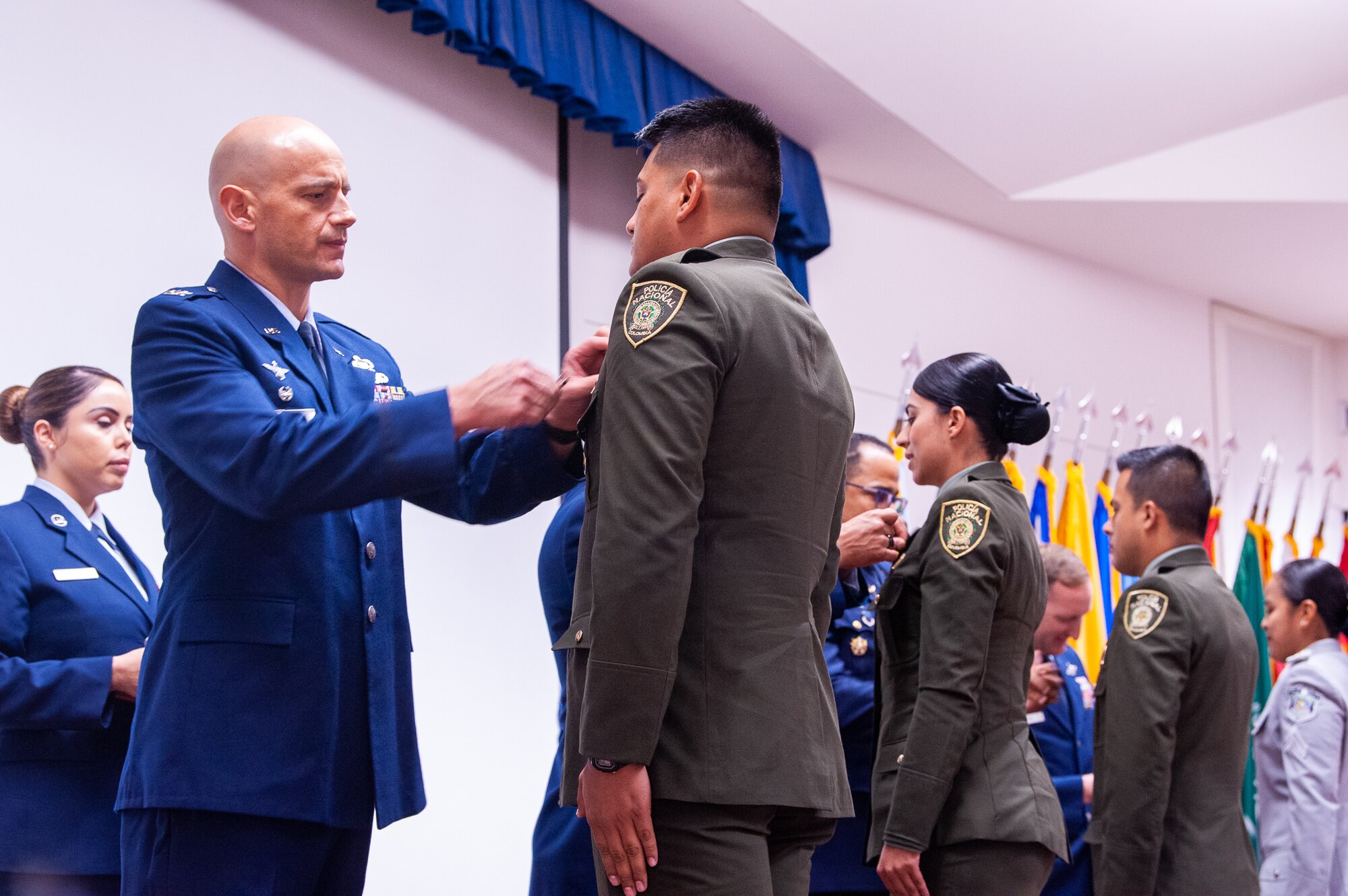 Col Jimenez pins wings on international students