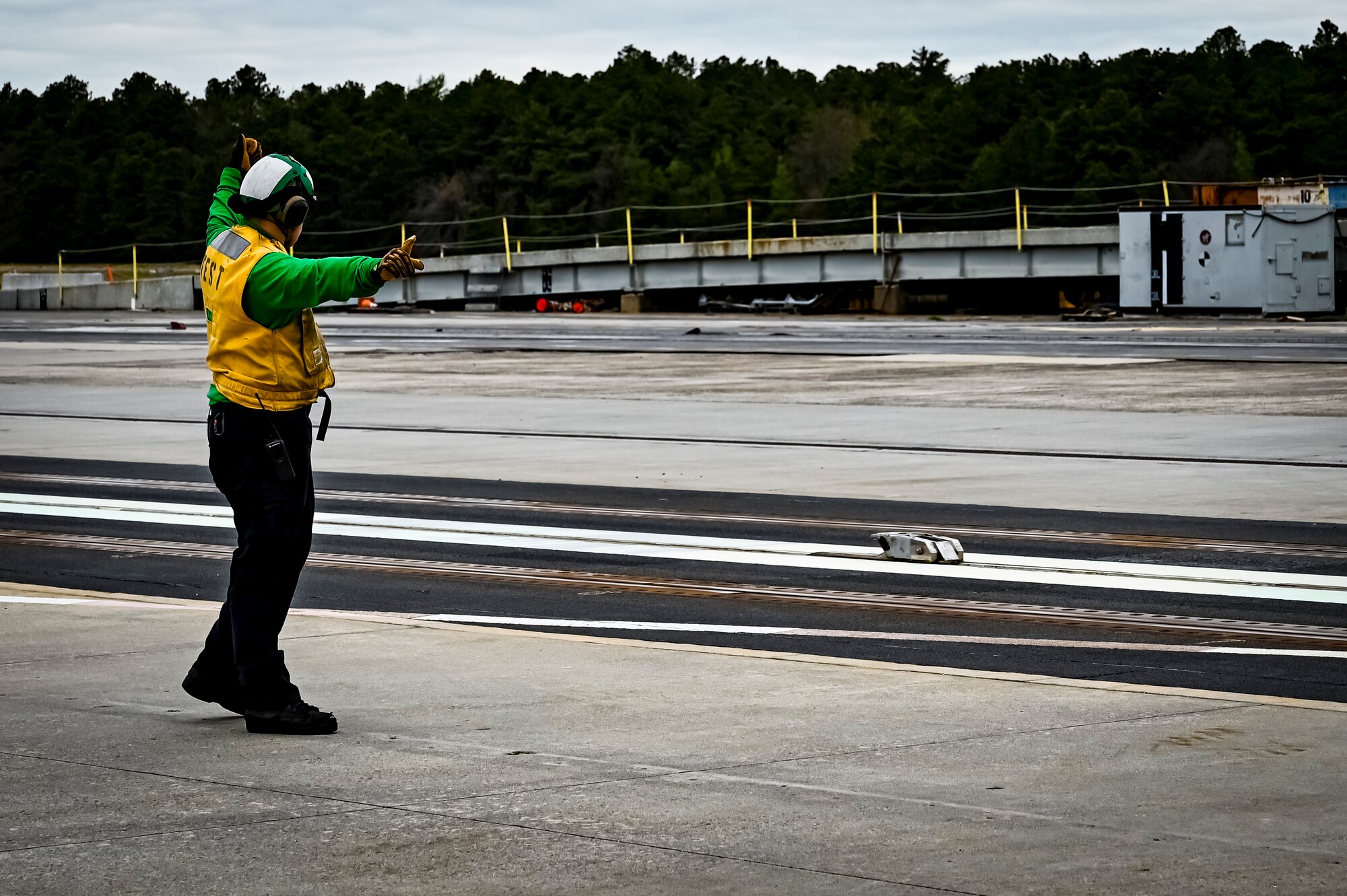 A test site maintainer with the Naval Air Warfare Center Aircraft Division launches a catapult at the electromagnetic aircraft launcher system testing site on May 11, 2022, at Joint Base McGuire-Dix-Lakehurst, N.J. NAVAIR's mission is to provide full life-cycle support of naval aviation aircraft, weapons and systems operated by Sailors and Marines. This support includes research, design, development and systems engineering; acquisition; test and evaluation; training facilities and equipment; repair and modification; and in-service engineering and logistics support.