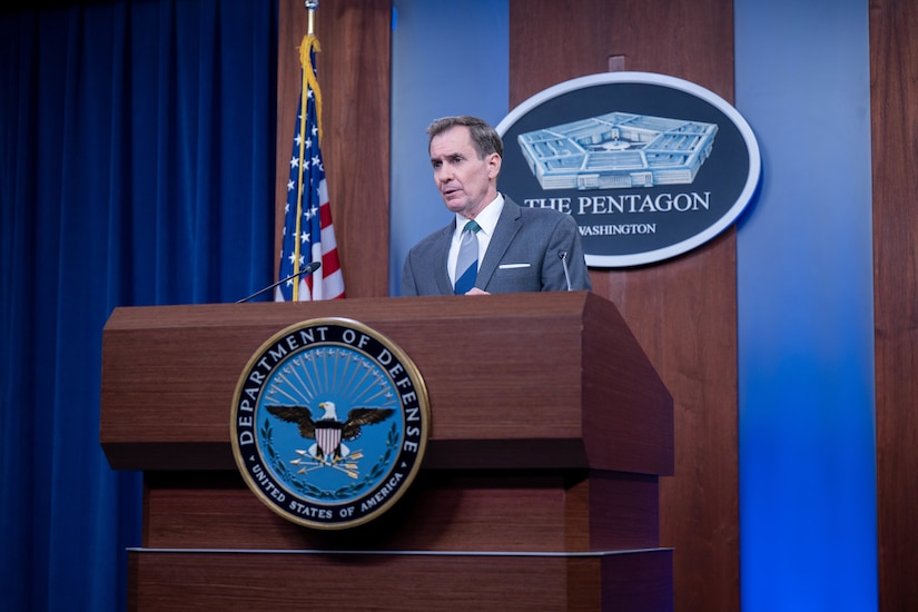 A man speaks from a podium.