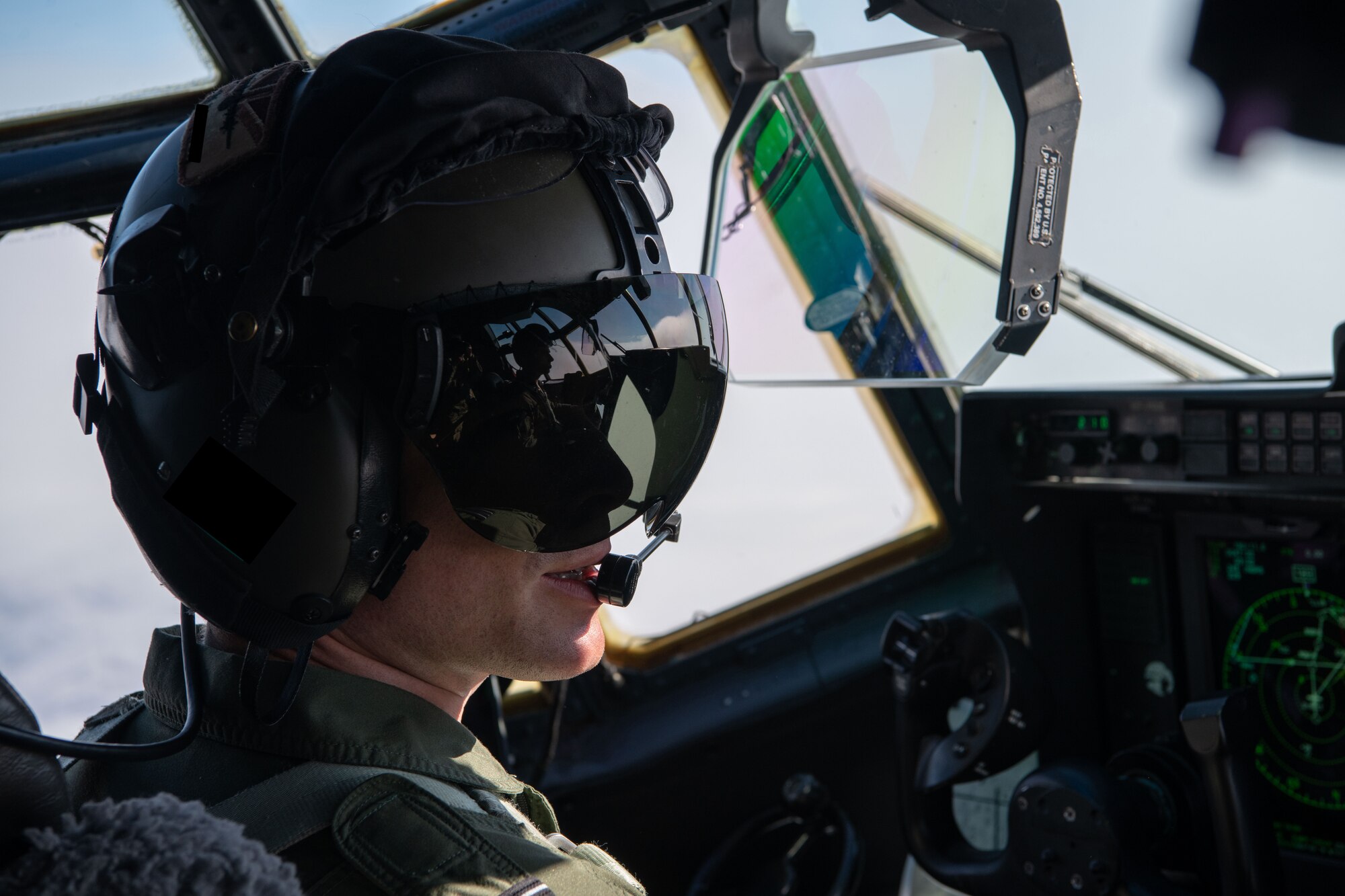 A photo of a pilot wearing a helmet