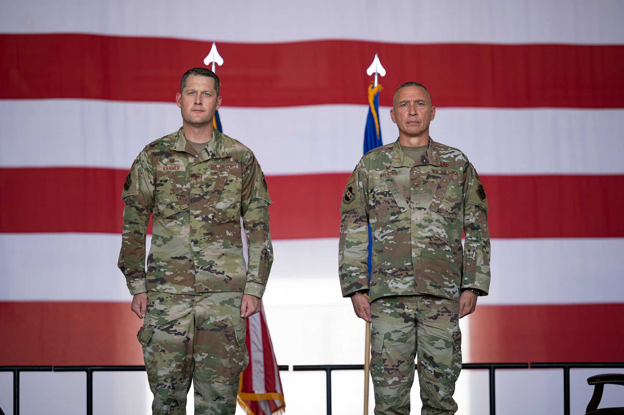 Col. Joseph Kramer, 7th Bomb Wing commander, stands beside Col. Brady Wilkins, outgoing 7th Maintenance Group commander, during a Change of Command ceremony at Dyess Air Force Base, Texas, May 13, 2022. Changes of command in the military are a tradition that formally represent the transfer of authority from one leader to another. (U.S. Air Force photo by Senior Airman Josiah Brown)