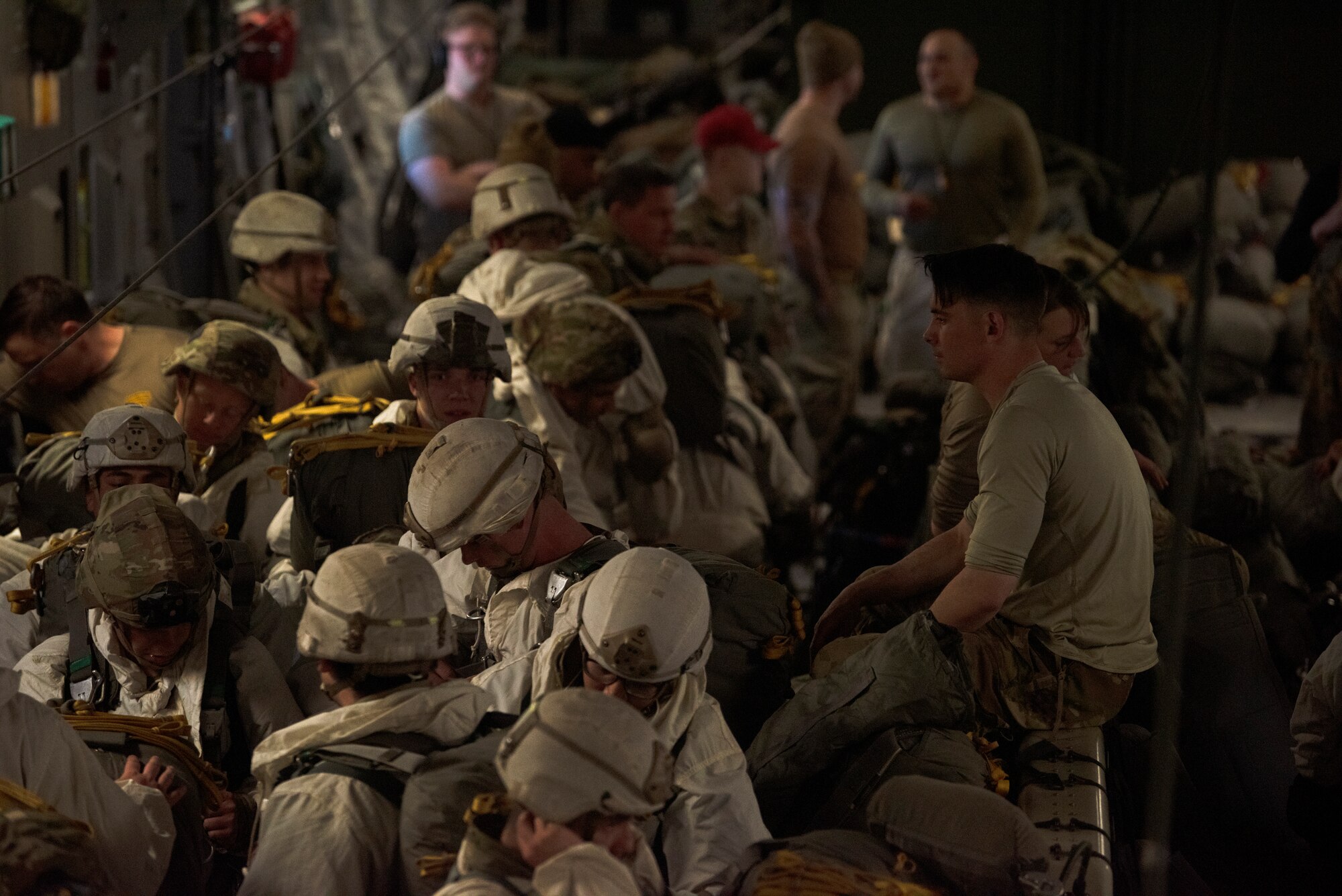 U.S. Soldiers with the 4th Brigade Combat Team, 25th Infantry Division prepare for an airdrop mission over Norway during Exercise Swift Response, May 10, 2022. Approximately 9,000 service members from 17 Allied and partner nations will participate in Swift Response, including approximately 2,700 U.S. Soldiers and Airmen. (U.S. Air Force photo by Staff Sgt. Zoe Thacker)