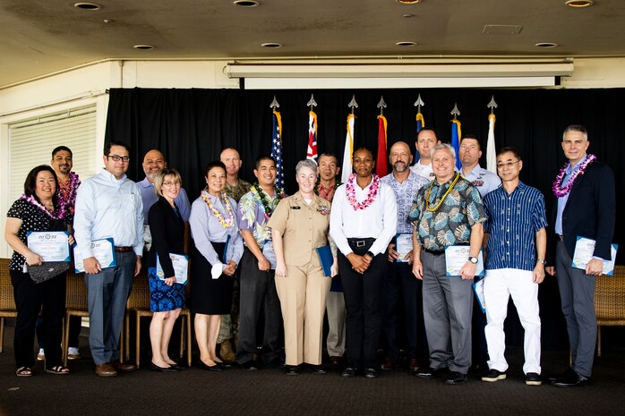 Winners of the Federal Leader, Supervisor, and Manager of the Year category pose for a photo during the 66th Annual Excellence in Federal Government Awards Ceremony, Hickam Officers’ Club, Joint Base Pearl Harbor-Hickam, May 6, 2022. The purpose of the ceremony was to acknowledge the hard work of U.S. service members and civilians across the federal government. (U.S. Marine Corps photo by Cpl. Samantha Sanchez)