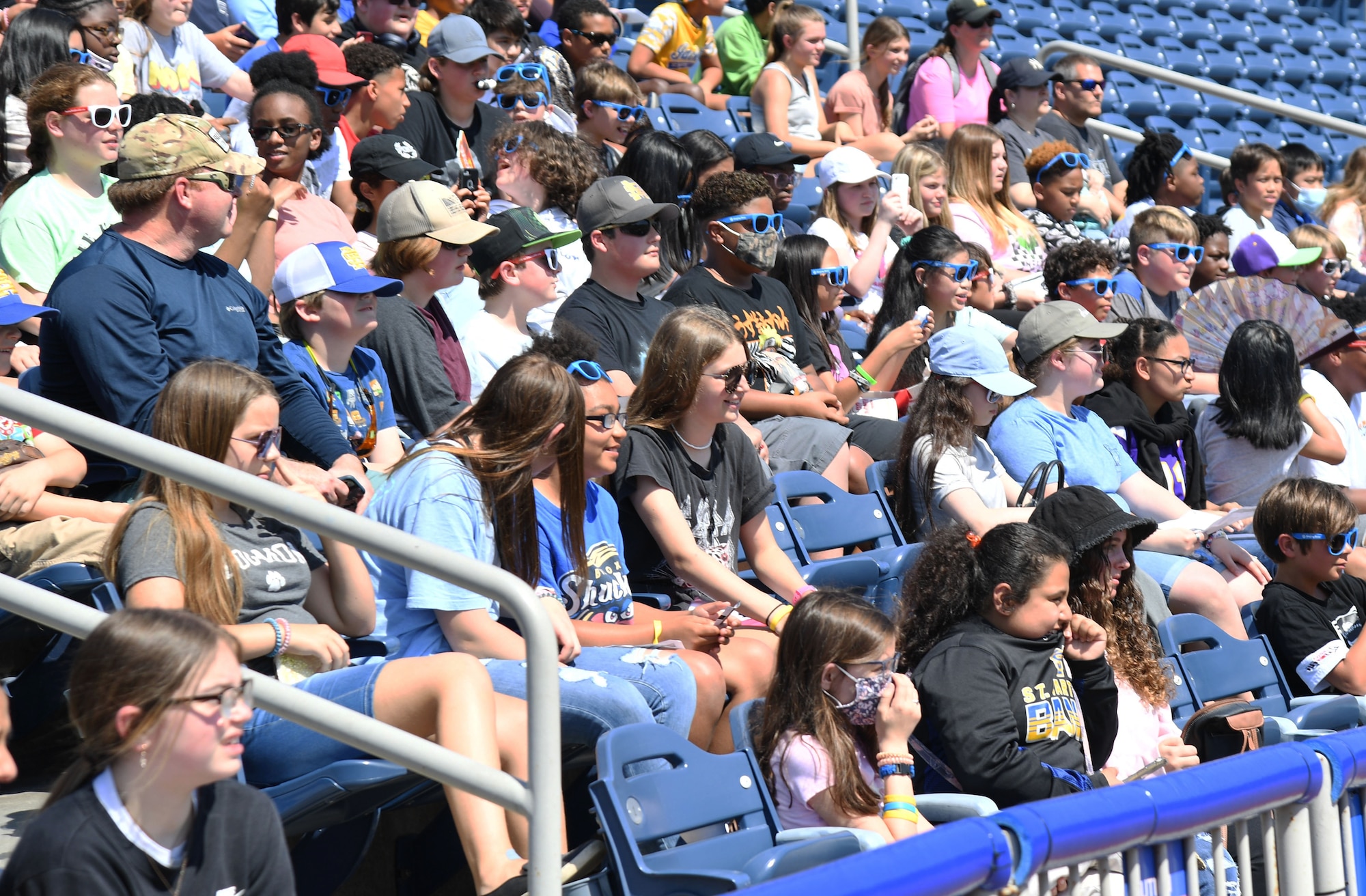 Local school students, teachers and parents attend the Biloxi Shuckers Education Day event in Biloxi, Mississippi, May 11, 2022. The event allowed Airmen from the 81st Training Group to set up training equipment displays for local school-aged children to view during the Biloxi Shuckers' game. (U.S. Air Force photo by Kemberly Groue)