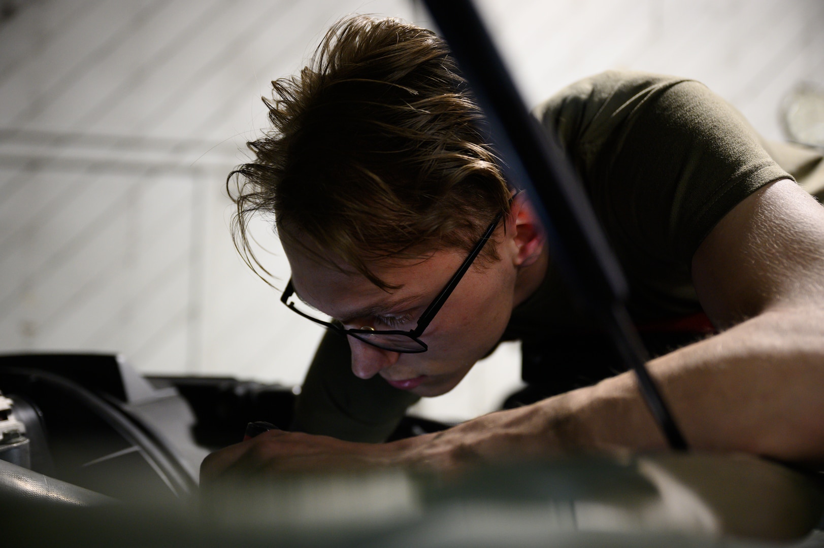 U.S. Air Force Airman 1st Class John Anderson, a 354th Logistics Readiness Squadron Firetruck and Refueling Maintenance apprentice, performs preventative maintenance on a vehicle during RED FLAG-Alaska 22-1 on Eielson Air Force Base, Alaska, May 11, 2022.