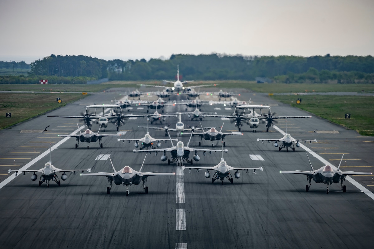 Aircraft including 16 U.S. Air Force F-16CM Fighting Falcons, 12 Japan Air Self-Defense Force F-35A Lightning II Joint Strike Fighters, two JASDF E-2C Hawkeyes, one JASDF CH-47 Chinook, one U.S. Navy EA-18G Growler, one USN C-12 Huron, and one USN P-8 Poseidon, perform a base capabilities demonstration to culminate a week-long readiness exercise at Misawa Air Base, Japan, May 13, 2022. The large formation was part of a routine exercise scenario that tested the 35th Fighter Wing's ability to generate airpower in support of the defense of Japan and other partner nations, ensuring the stability and security of a free and open Indo-Pacific region. (U.S. Air Force photo by Airman 1st Class Leon Redfern)