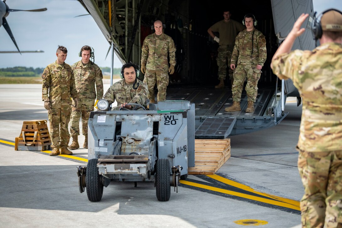 U.S. Airmen from Yokota and Misawa Air Base, Japan, unload cargo from a C-130J Super Hercules assigned to the 36th Airlift Squadron during exercise Beverly Sunrise 22-04 at Misawa Air Base, Japan, May 12, 2022. Agile Combat Employment enables U.S. forces in the Indo-Pacific region to operate from locations with varying levels of capacity and support, ensuring Airmen and aircrews are postured to respond across the spectrum of military operations. (U.S. Air Force photo by Airman 1st Class Leon Redfern)