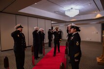 Rear Adm. Mark Sucato, prospective commander of Navy Region Northwest, renders a hand salute as part of a change of command ceremony at Naval Base Kitsap-Bangor, May 12, 2022.