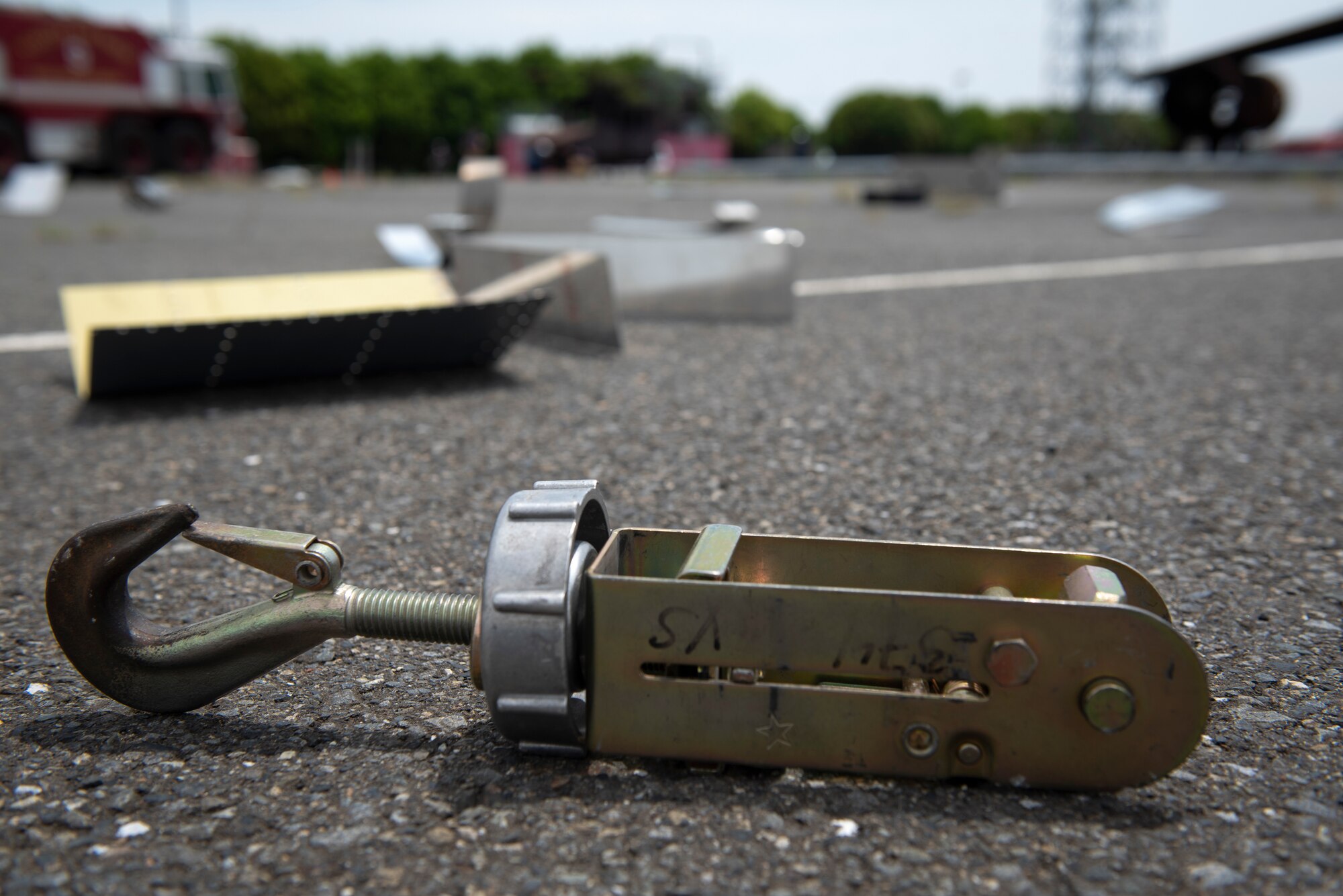 Simulated aircraft debris liter the ground during a major accident response exercise at Yokota Air Base, Japan, May 11, 2022. The MARE tested the base’s response to a simulated F-16 Fighting Falcon crash and the ability to collaborate with mission partners. Due to the support of Naval Air Facility Atsugi, Commander Fleet Activities Yokosuka, Misawa Air Base and Tokyo Fire Department, Fussa Fire Station, this was the largest MARE in Yokota history. (U.S. Air Force photo by Machiko Arita)